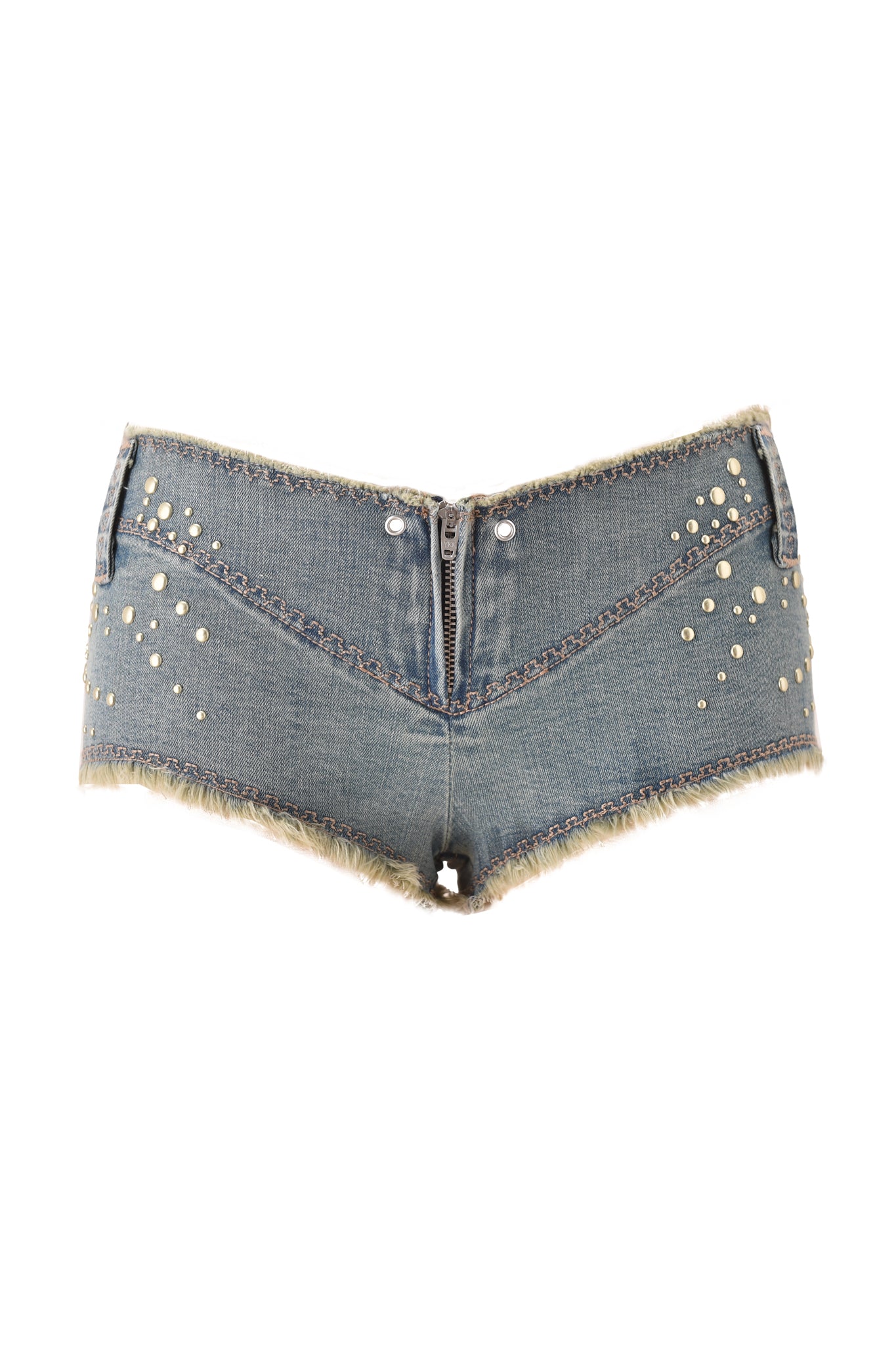 The VEXA SHORT - VINTAGE BLUE DENIM by I.AM.GIA features ultra low-rise light blue denim, frayed edges, a front zipper, silver buttons, and pearl-like studs arranged in patterns on the front.