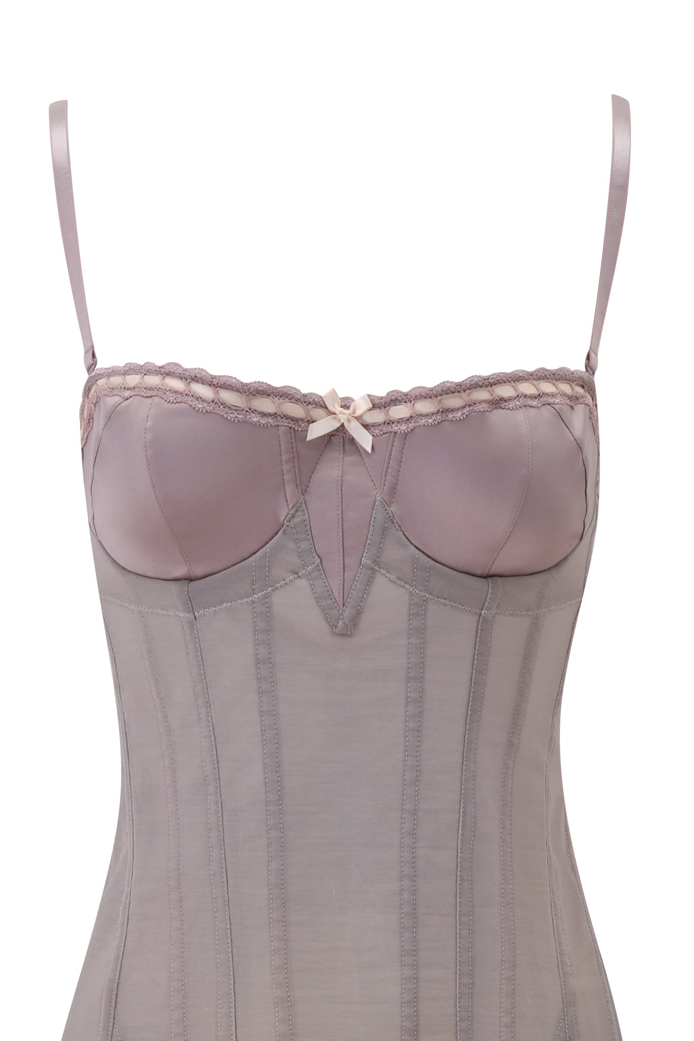 A close-up of the I.AM.GIA ODETTE DRESS in Dove, featuring corset-style detailing, thin straps, underwire cups, decorative stitching, sheer mesh panels, and a small bow at the neckline.