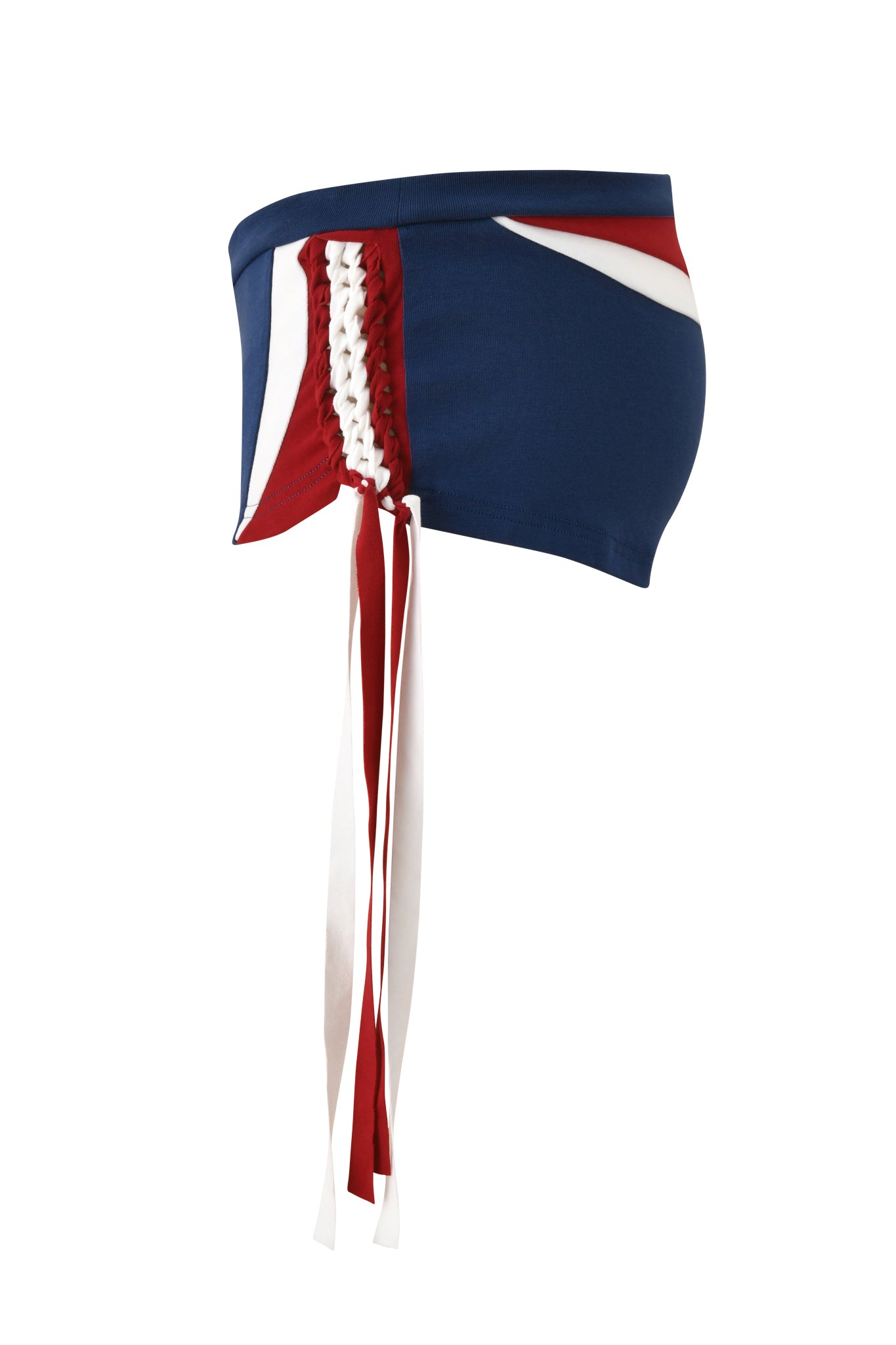 The NOVIA MICRO SPORT SHORT - NAVY by I.AM.GIA is a blue low rise stretch cotton short with red and white side panels, a white lace-up front, and long red and white ribbon ties, shown in side profile against a plain white background.