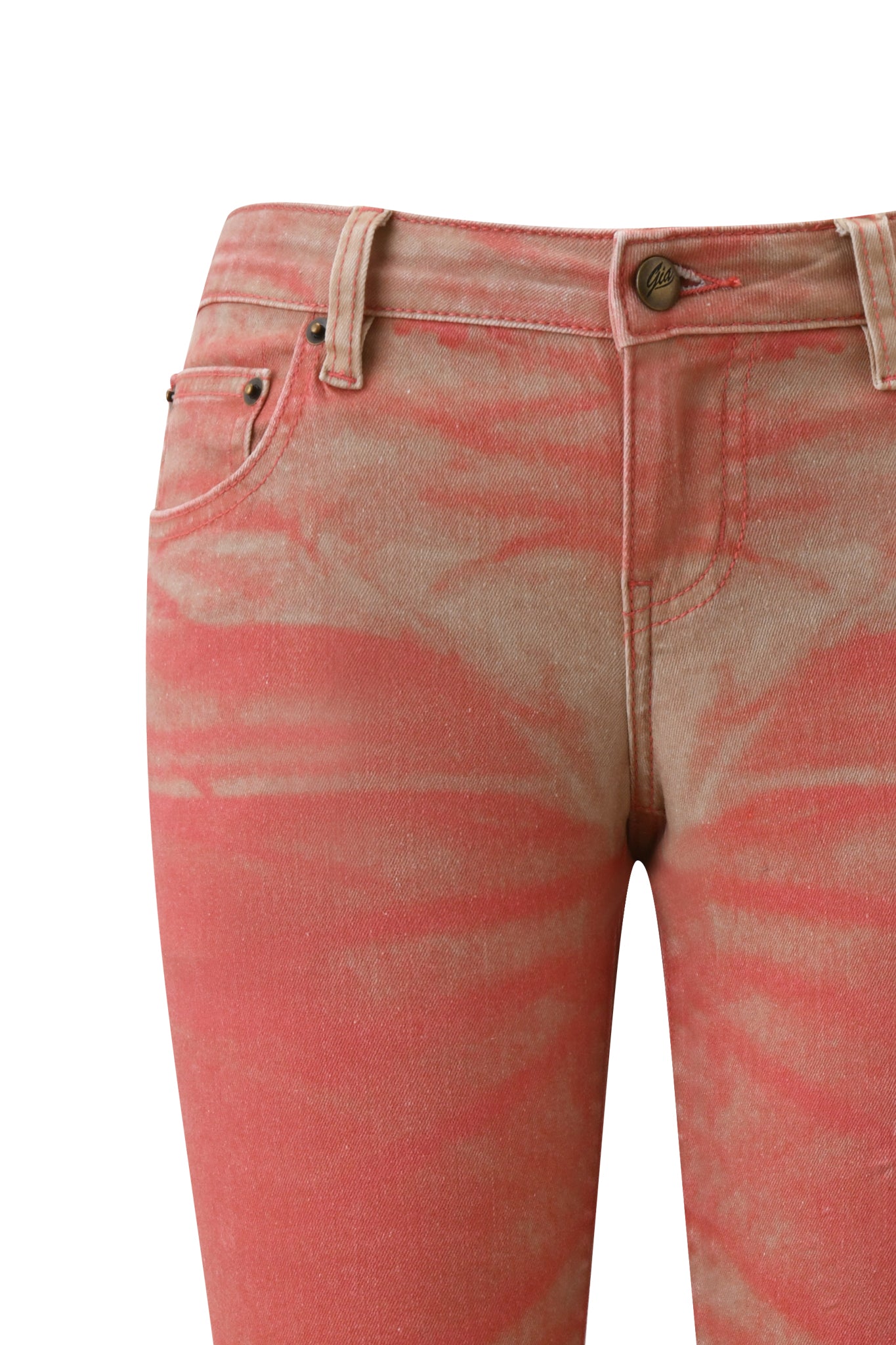 Close-up of the I.AM.GIA SUNSET CAPRI JEAN - PEACH, a pair of high-waisted capri denim jeans featuring a pink and beige tie-dye pattern in a soft peach ombré wash, shown from the waist to the thighs against a white background.
