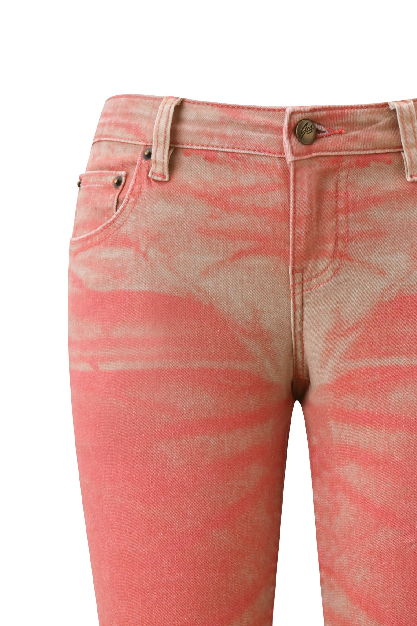 Close-up of the I.AM.GIA SUNSET CAPRI JEAN - PEACH, showcasing a pink and beige tie-dye design with a soft peach ombré wash. The image emphasizes the waistband, front pockets, belt loops, zipper, and button set against a white background. Made from stretch denim for enhanced comfort, these capri jeans blend contemporary style with everyday ease.