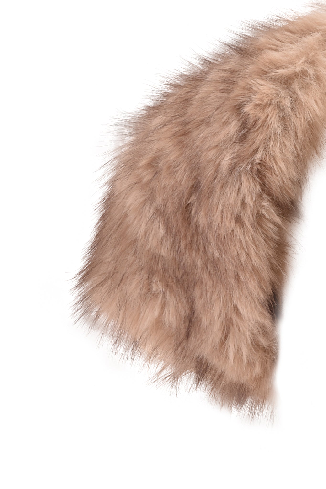 A close-up of the ALBA FAUX FUR CAP SLEEVE BOLERO in taupe by I.AM.GIA showcases its fluffy, light brown faux fur with a soft, wispy texture against a white background—perfect for statement layering, this bolero adds both warmth and style to any outfit.