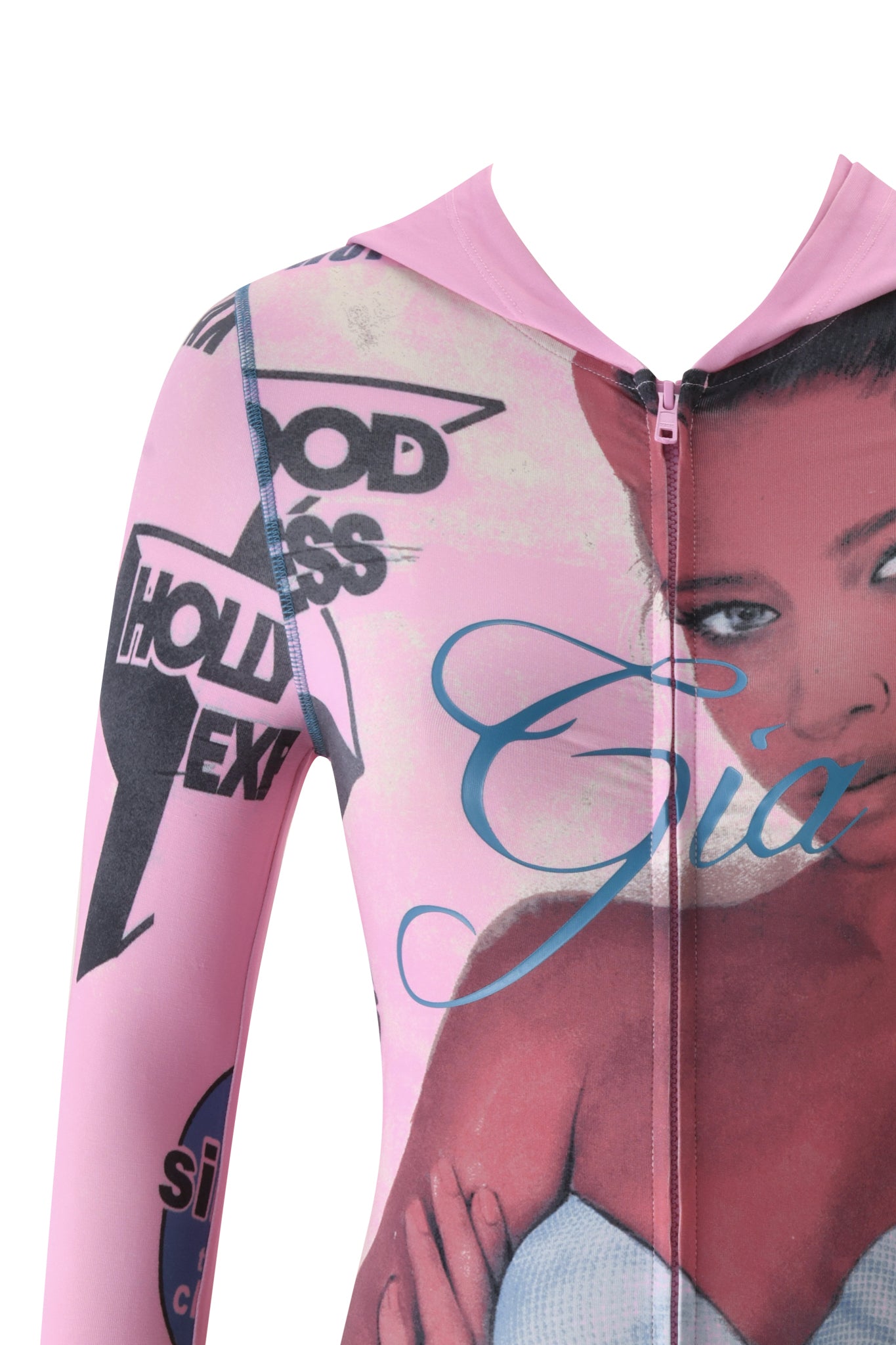 Close-up of the T-REX BLARE HOODIE in pink by I.AM.GIA, featuring a partial image of a woman’s face, bold text, and various graphic elements in black and blue across the fabric as part of the brand’s signature placement print.