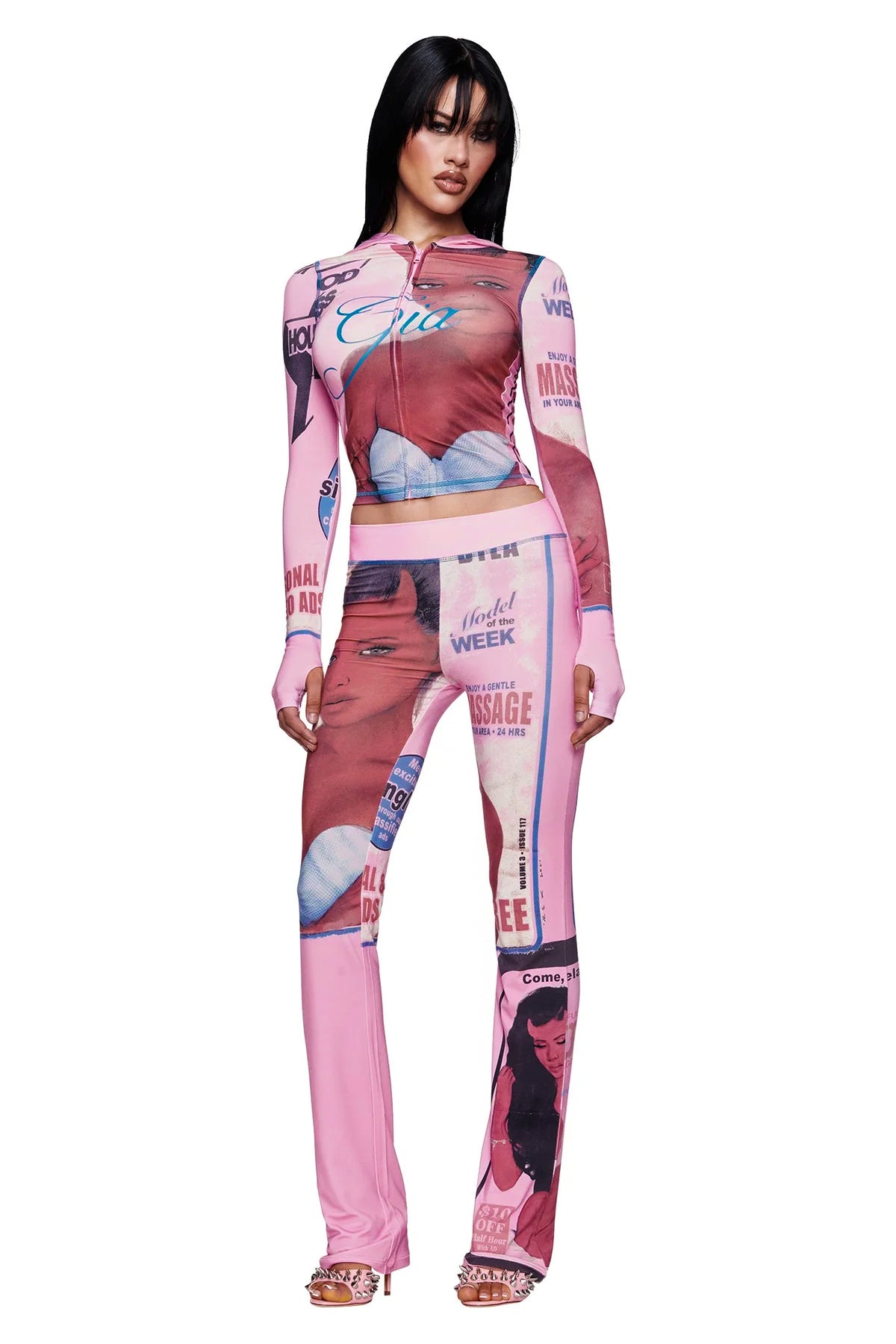 A woman stands confidently with her hands by her sides, facing forward, wearing the pink T-REX BLARE HOODIE by I.AM.GIA.