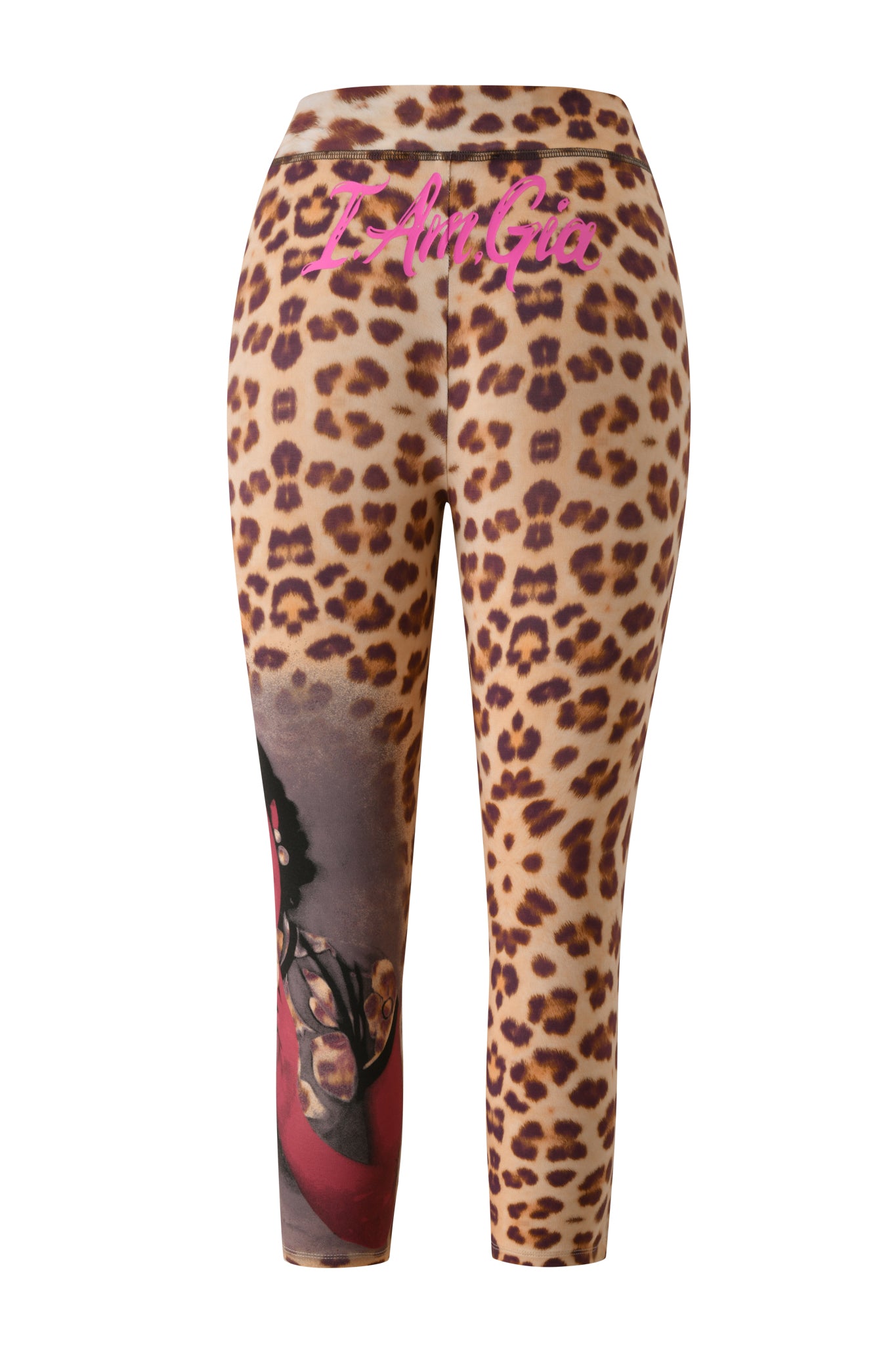 The T-REX BLARE CAPRI - WILD CARD by I.AM.GIA features a high-waisted leopard print design, accented with pink “J. Fai Gia” text on the waistband and a striking partial graphic of a woman in glasses and red clothing on one leg. Crafted from soft bamboo fabrication, these capri leggings deliver both comfort and bold statement style.
