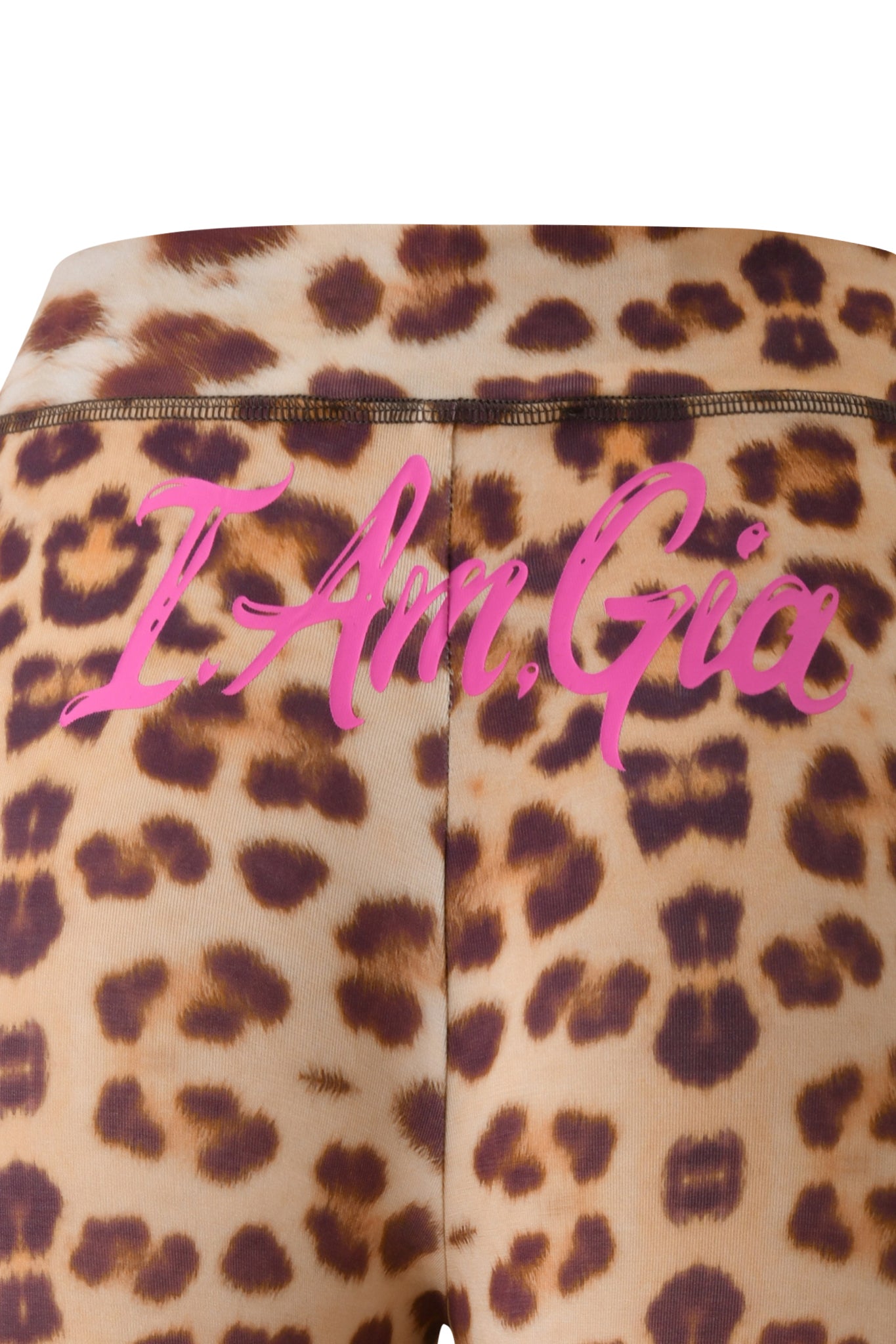 Leopard print fabric with pink script text that reads "I Am Gia" across the back captures I.AM.GIA’s signature style—ideal for creating an edgy look when paired with the T-REX BLARE CAPRI - WILD CARD by I.AM.GIA.
