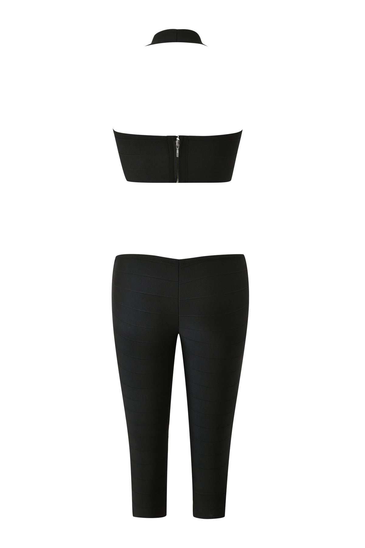 Back view of the EVA BANDAGE CAPRI JUMPSUIT in black by I.AM.GIA, showcasing a strapless crop top with zipper detail and high-waisted, fitted capri pants.