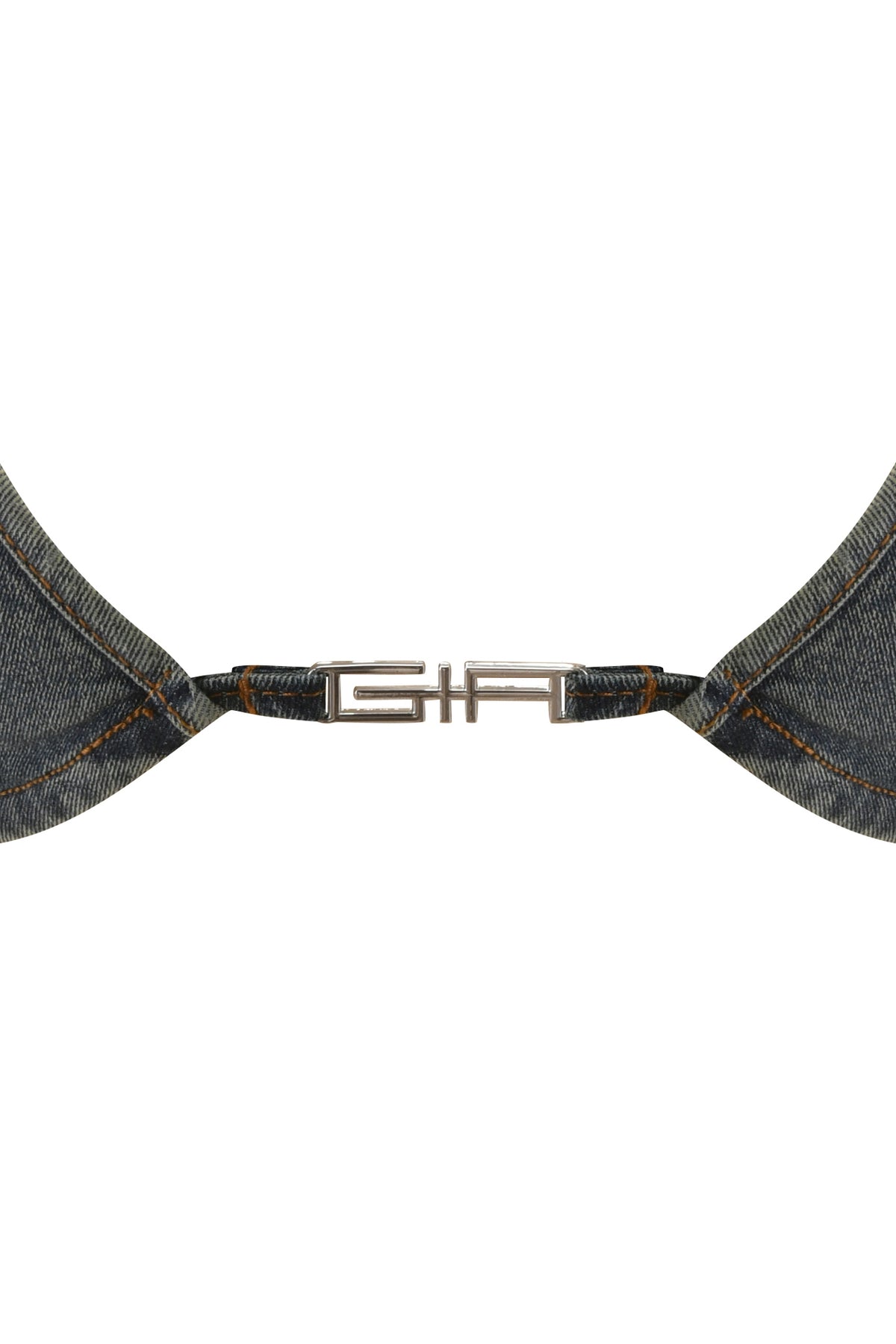 Close-up of the JET TRIANGLE TOP - FADED INDIGO by I.AM.GIA, featuring a metal clasp connecting two pieces of denim fabric with visible orange stitching, set against a white background.