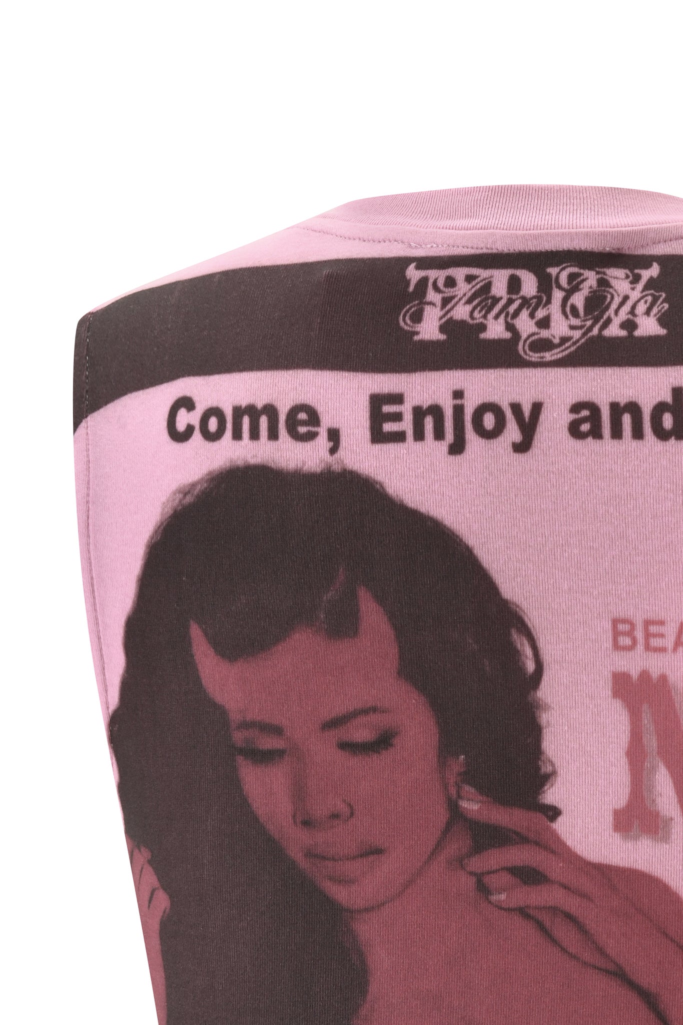 Close-up of the T-REX COURTNEY TANK - PINK by I.AM.GIA, a baby pink heavyweight jersey muscle tank featuring a vintage-inspired graphic of a woman touching her ear and stylized, partially visible "Come, Enjoy and" text. This modern twist on classic retro vibes is perfect for making a statement.