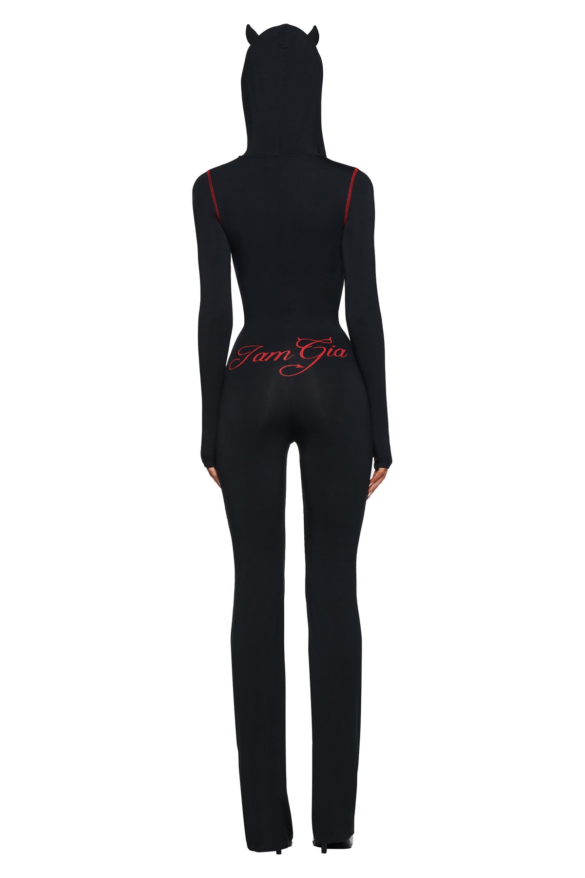 Person wearing the BLARE HORN JUMPSUIT - BLACK by I.AM.GIA, with a devil horn hood, red accents, and “I Am Gia” script on the lower back, standing with their back to the camera.
