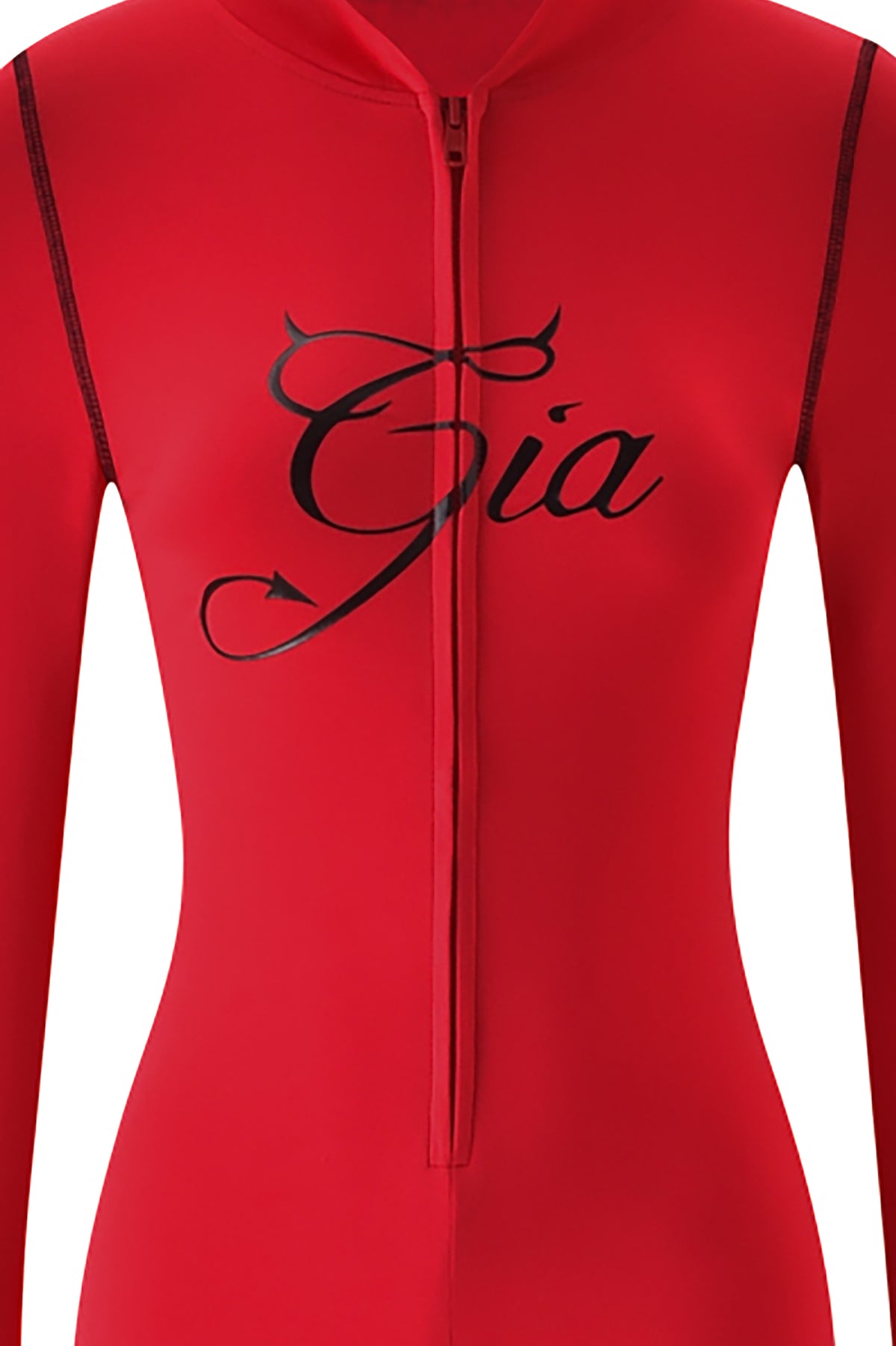 The BLARE HORN JUMPSUIT - RED by I.AM.GIA is a red zip-up bodysuit with “Gia” in black cursive across the chest, featuring a devil tail and horns on the “G.”.