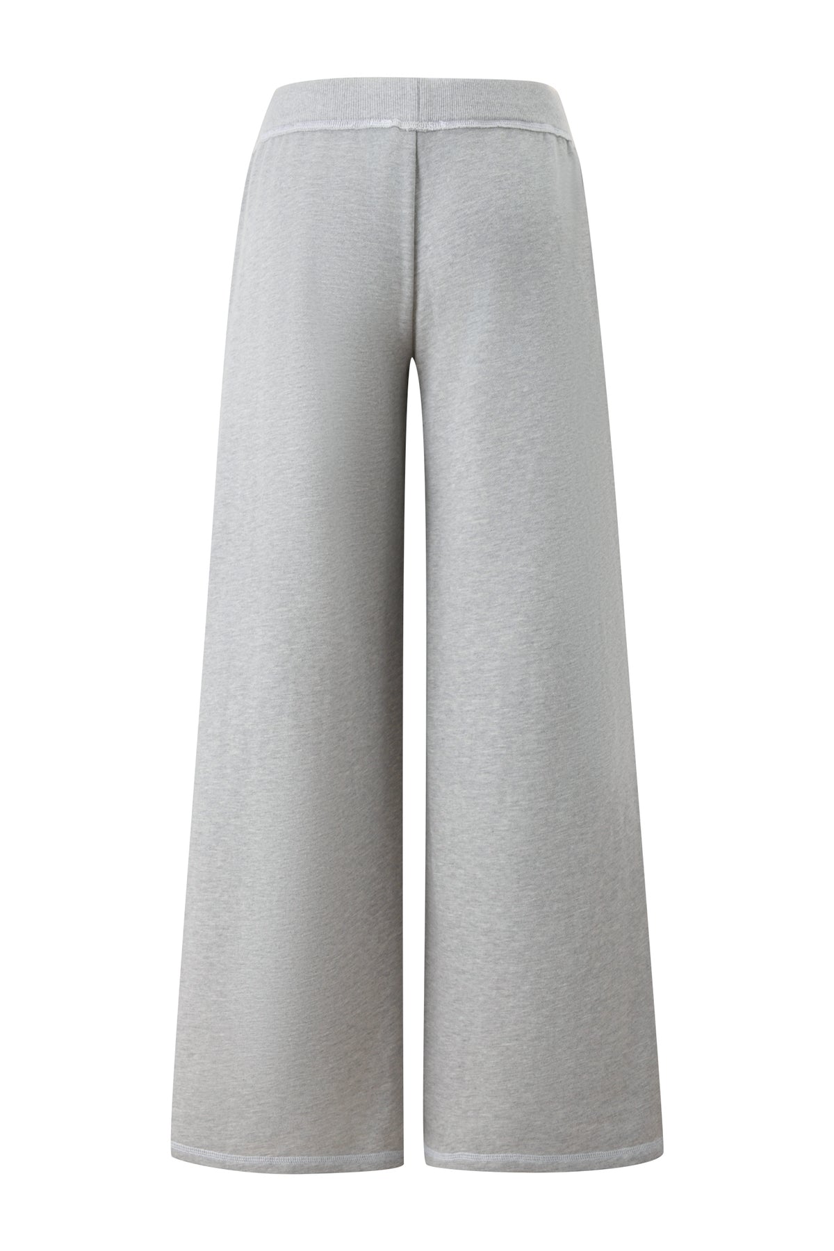 The KOKO TRACKPANT in Heather Grey by I.AM.GIA is pictured from the back, showcasing its wide-leg silhouette and high waistband with a clean finish—no visible pockets or closures. The soft, slightly textured fabric evokes the look and feel of premium French terry.