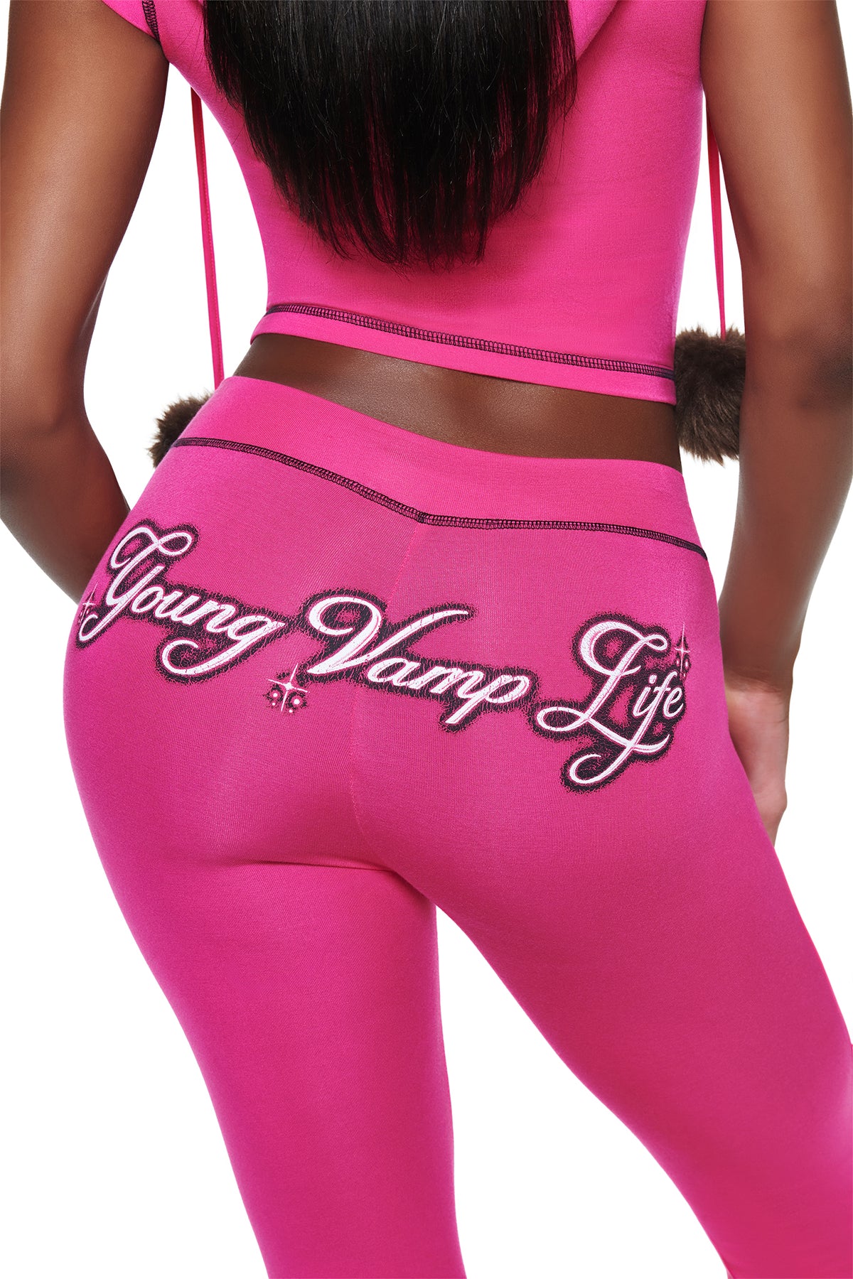 Hot pink YVL BLARE CAPRI - PINK leggings with “Young Vamp Life” embroidered in script across the back.