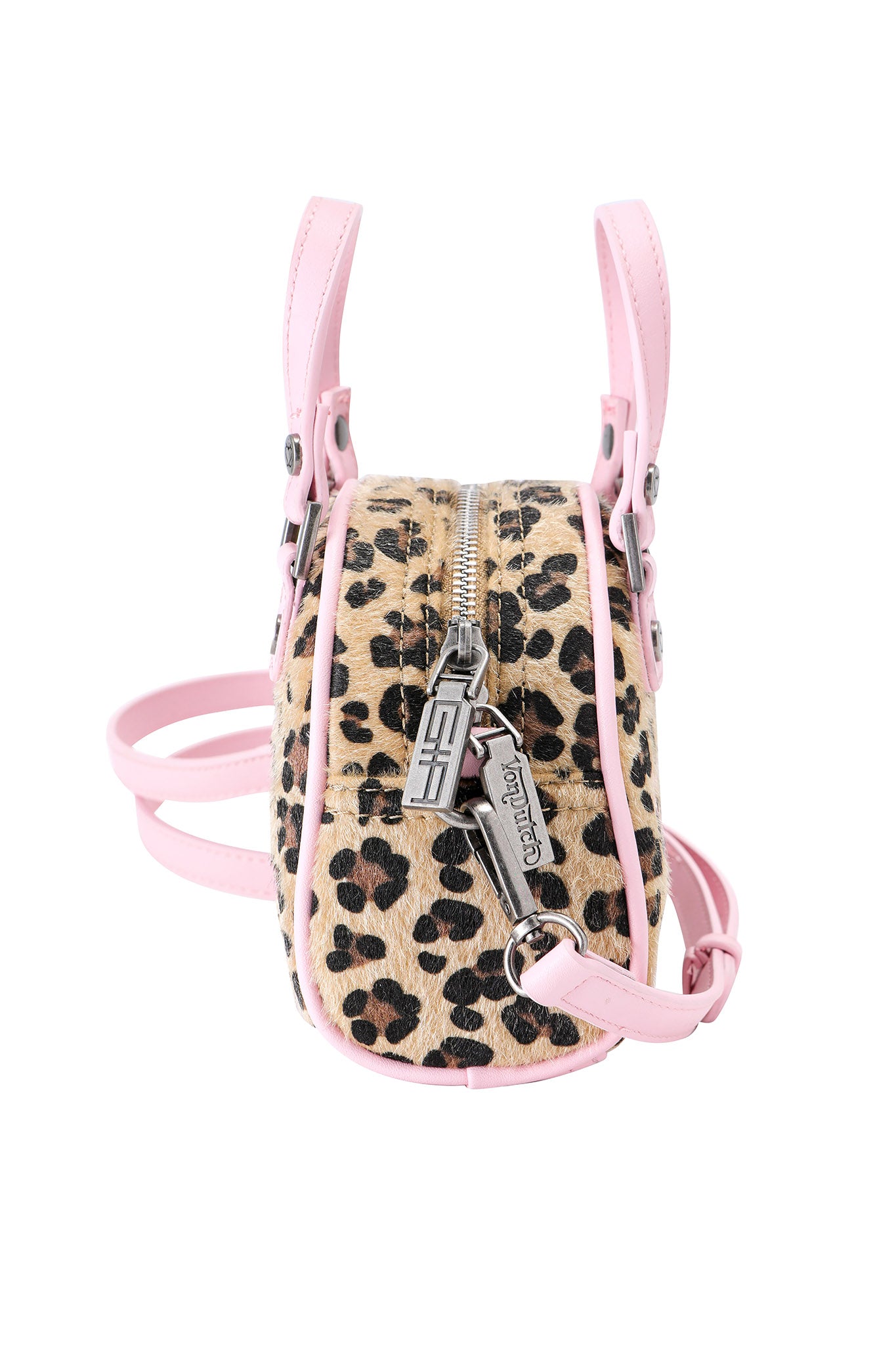The I.AM.GIA X VON DUTCH MINI BOWLING BAG - LEOPARD is a small leopard print bag with pink leather strap and trim, silver zipper, and metallic tags, inspired by the iconic Von Dutch bowling bag.