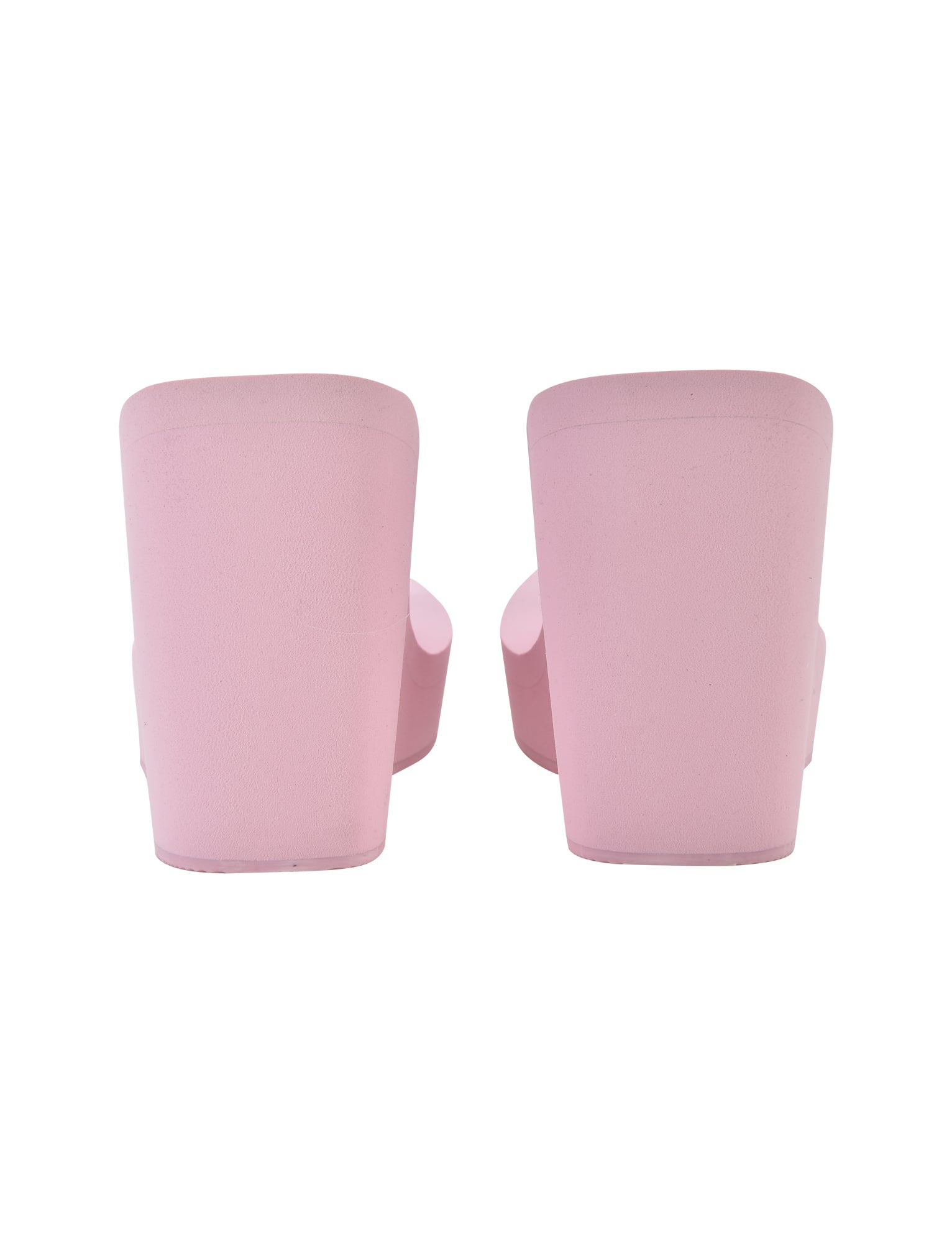 Rear view of a pair of I.AM.GIA SHELBY FLIP FLOP sandals in baby pink, featuring wide straps. The sandals boast a chunky platform sole and are designed with a smooth, matte finish. The image is taken against a plain white background.