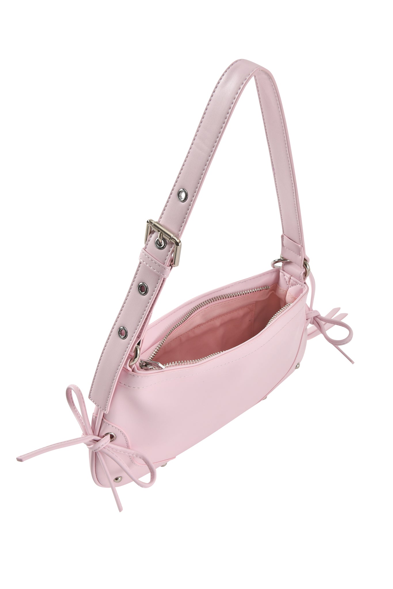 The HAYLEY BAG - BABY PINK by I.AM.GIA is a faux leather shoulder purse with a wide adjustable strap, metal hardware, side bows, and an open zipper that reveals a pink-lined interior.