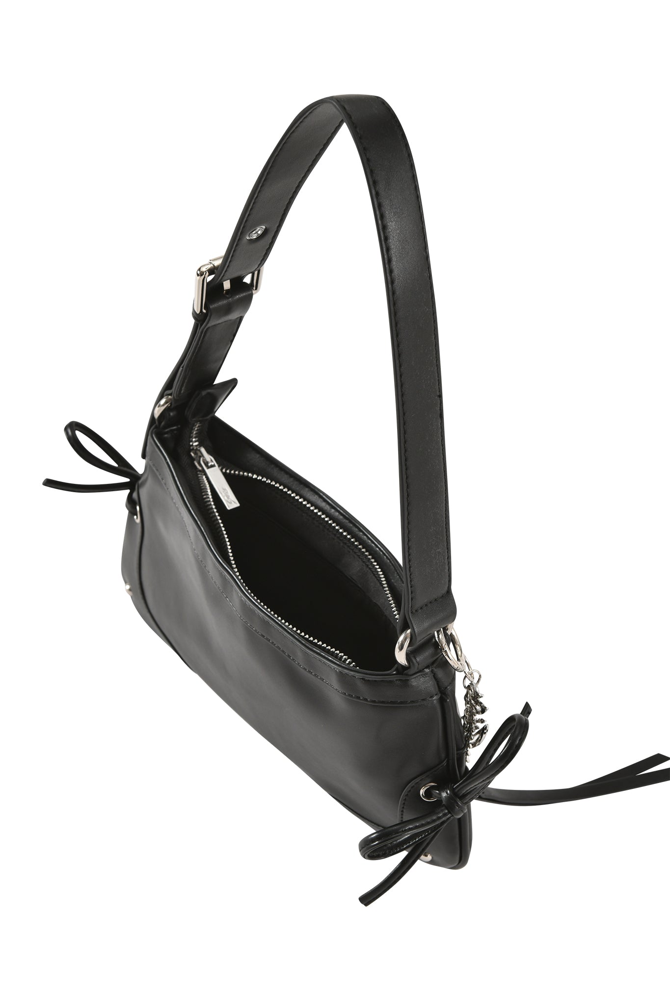 The HAYLEY BAG - BLACK by I.AM.GIA is a structured faux leather purse with silver hardware, zipper closure, decorative side bows, and an adjustable shoulder strap for versatile wear.