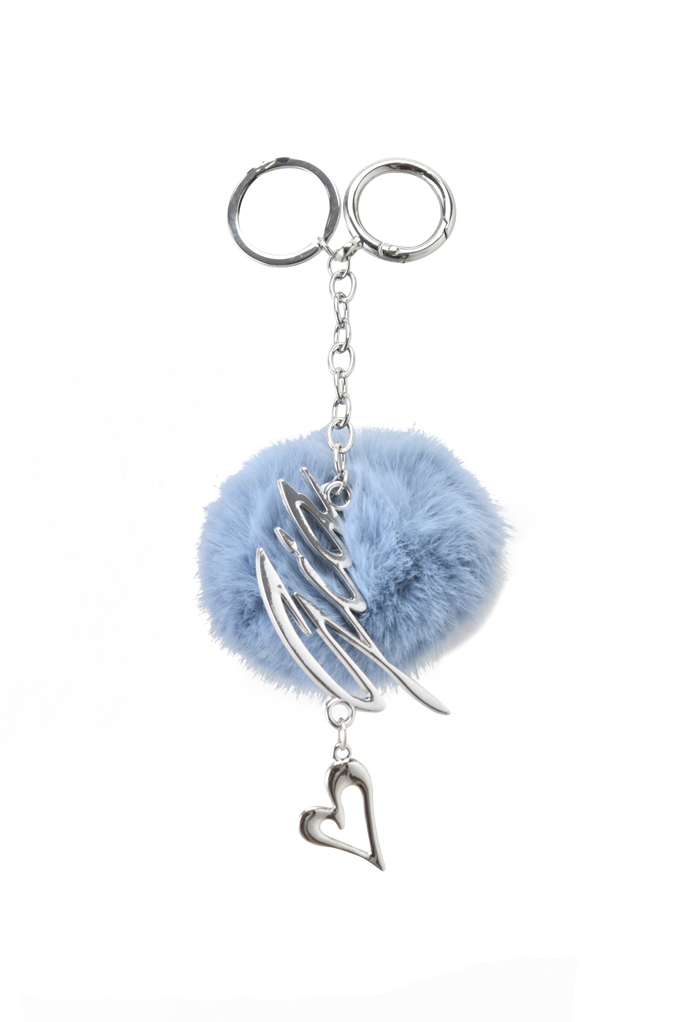 The LARSA KEYCHAIN - BLUE by I.AM.GIA showcases a fluffy light blue faux fur pom-pom, silver abstract accent, and heart charm, all on a sleek silver chain and key ring.