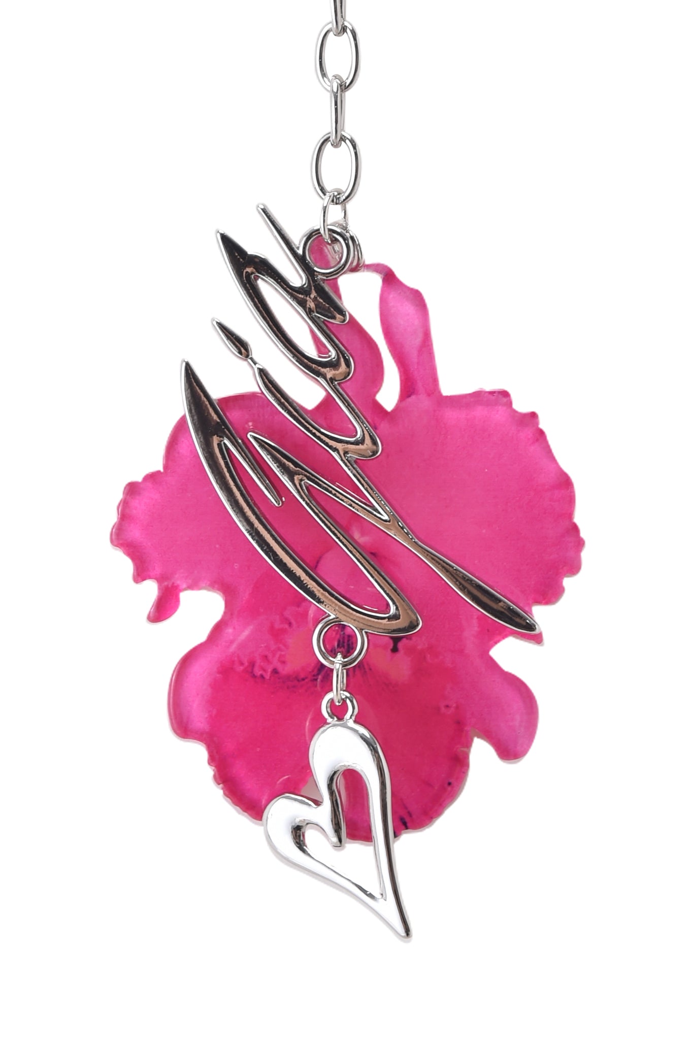 The I.AM.GIA ORCHID KEYCHAIN - NEON PINK features a script word pendant above a bright pink orchid flower with a silver-outlined heart charm, all hanging from a chain, reminiscent of a stylish floral keychain.