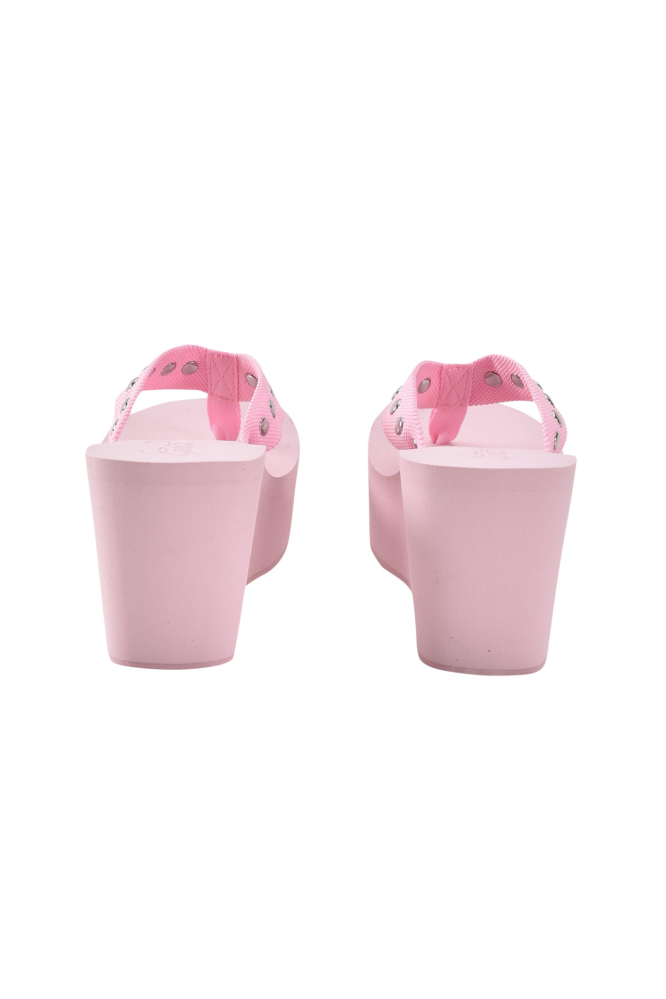 The I.AM.GIA SHELBY STUDDED FLIP FLOP 2.0 in baby pink features thick platform soles and pink fabric straps adorned with silver studs, shown from the back against a white background for a bold, stylish look.