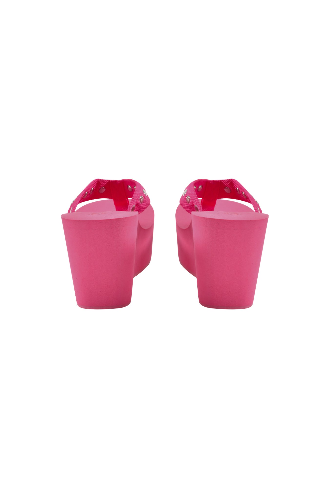 Rear view of the I.AM.GIA SHELBY STUDDED FLIP FLOP 2.0 in hot pink, featuring studded straps and high platform wedge heels, shown against a white background.