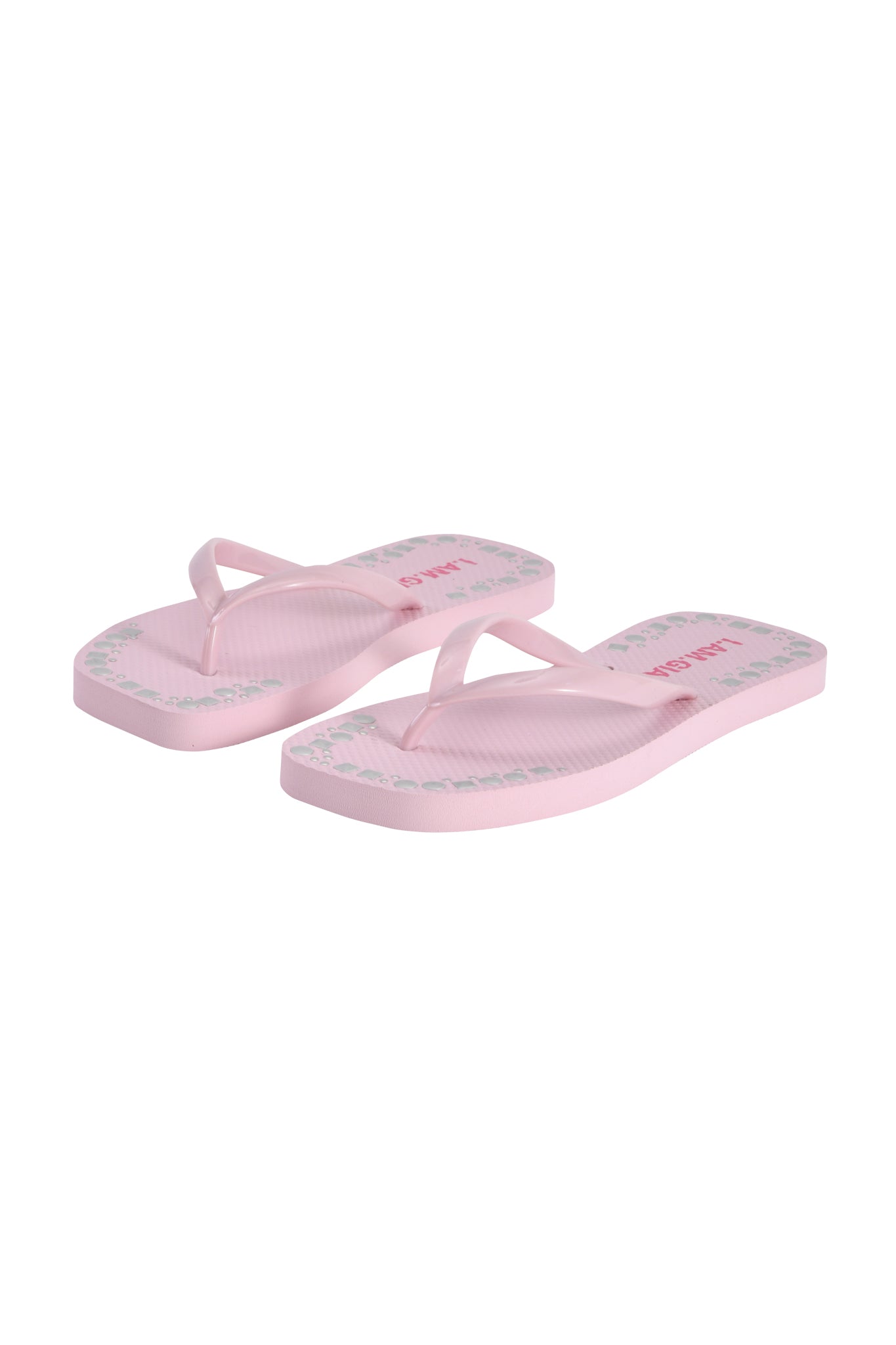 The INKA STUDDED FLIP FLOP by I.AM.GIA features thin straps and a subtle edge pattern in baby pink, shown on a white background.