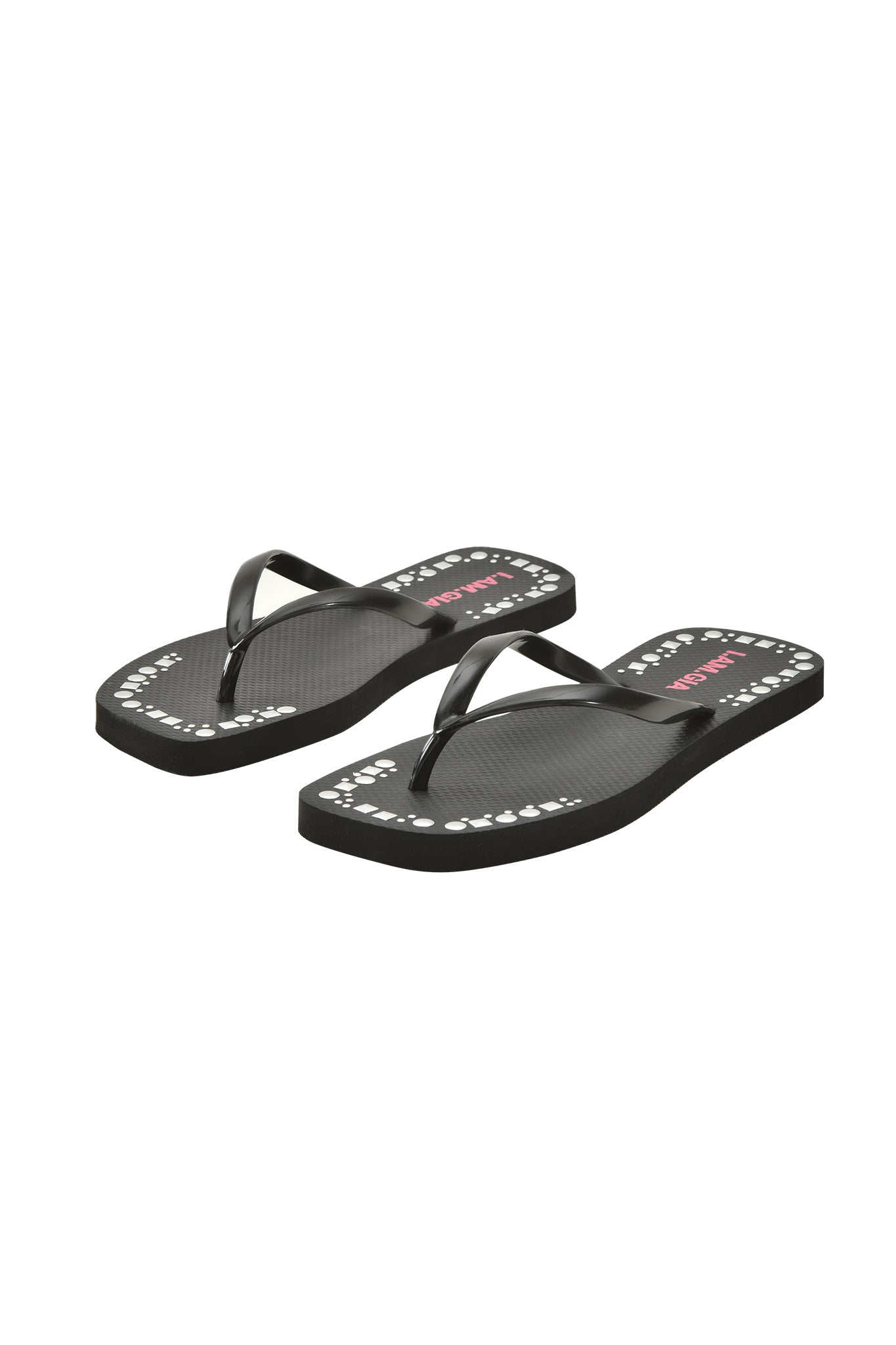 The INKA STUDDED FLIP FLOP - BLACK by I.AM.GIA features black straps, white text and small graphics on the footbed edges, an extra-soft foam footbed, and a textured sole; displayed on a white background.