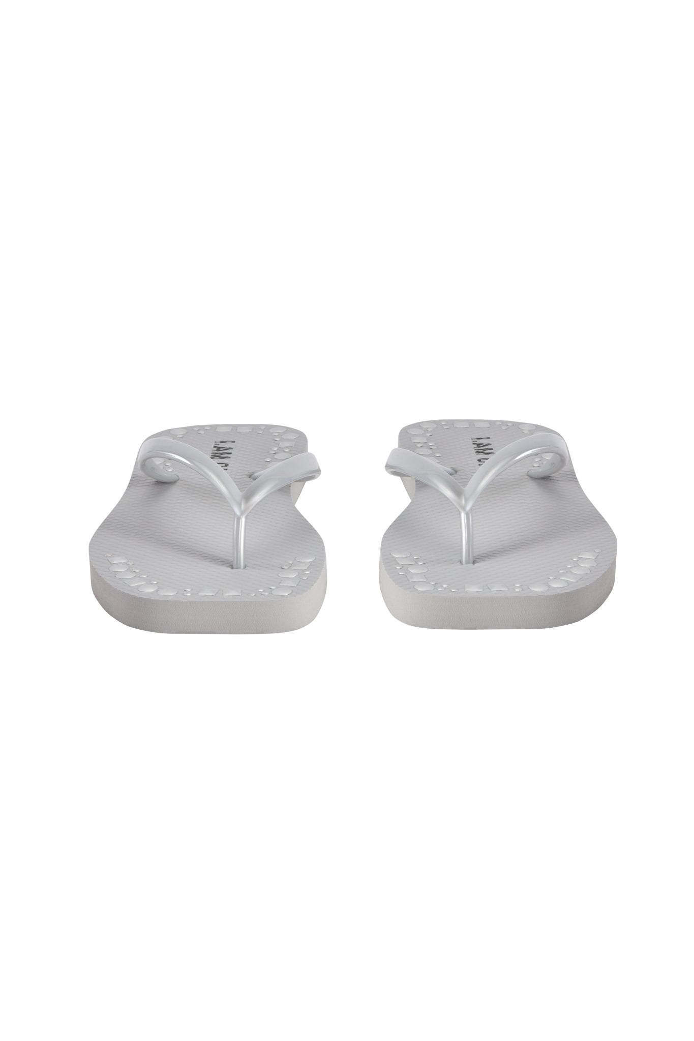 The I.AM.GIA INKA STUDDED FLIP FLOP in silver is shown from the front on a white background, featuring a comfortable footbed and stylish studded straps.