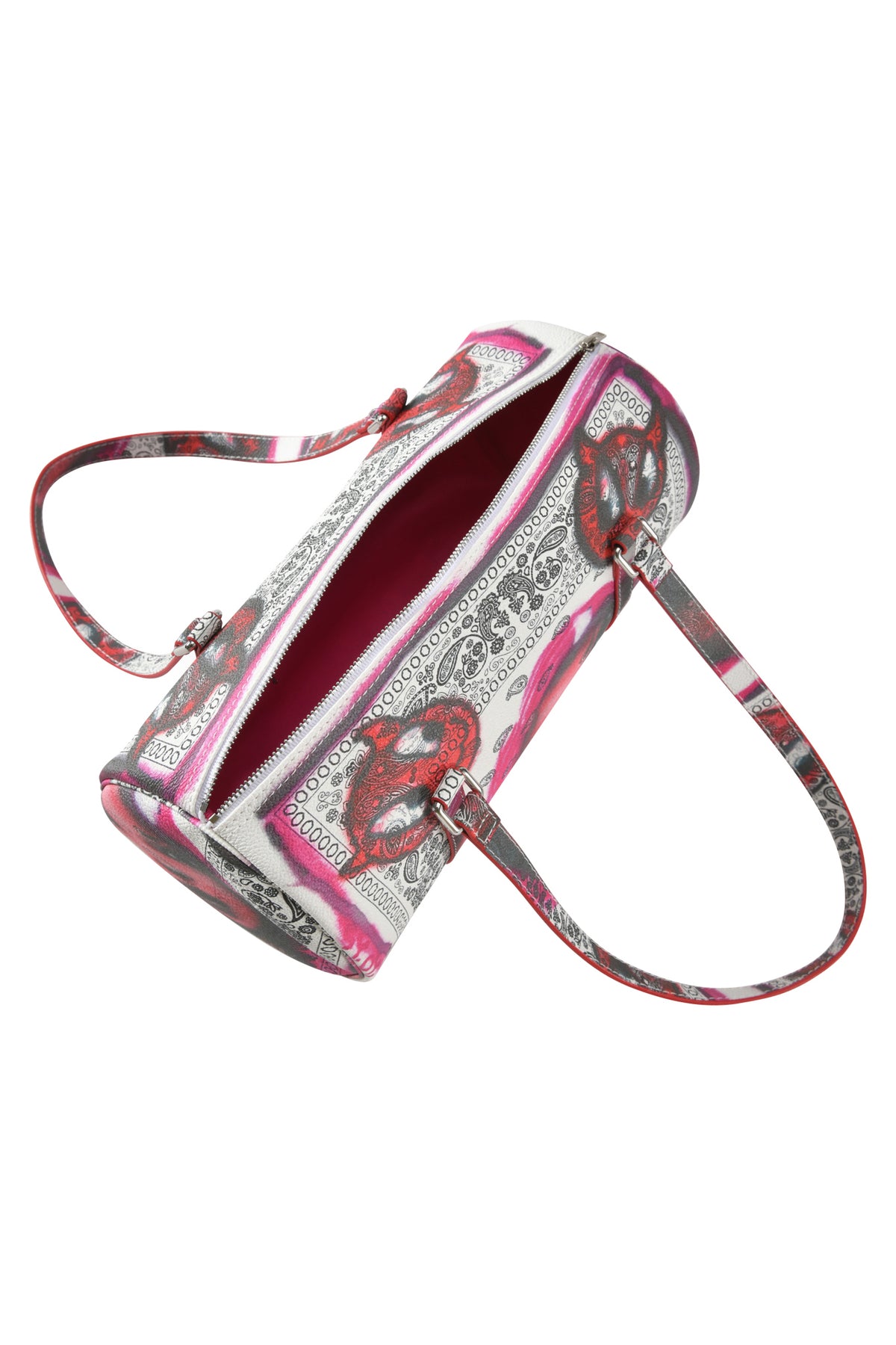The T-REX BARREL BAG - PAISLEY FACE by I.AM.GIA is a cylindrical faux leather purse with pink, red, black, and white paisley bandana print, dual shoulder straps, zip top, and bright pink interior.
