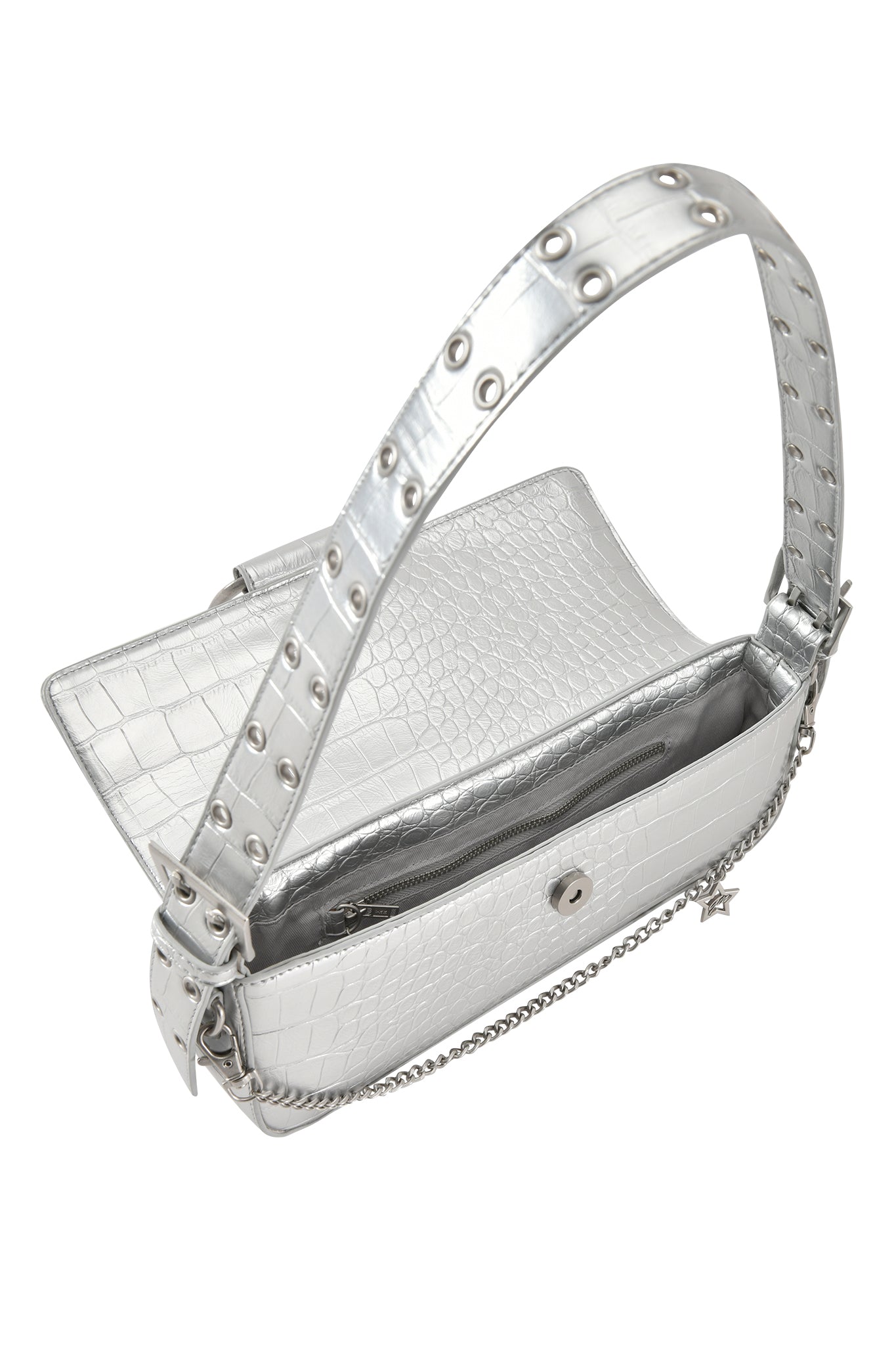 The I.AM.GIA MILA METALLIC BAG in Silver Metallic is a mini shoulder purse with a faux crocodile texture, grommet-studded adjustable strap, magnetic closure, chain detail, and an open flap revealing an inner zippered pocket.