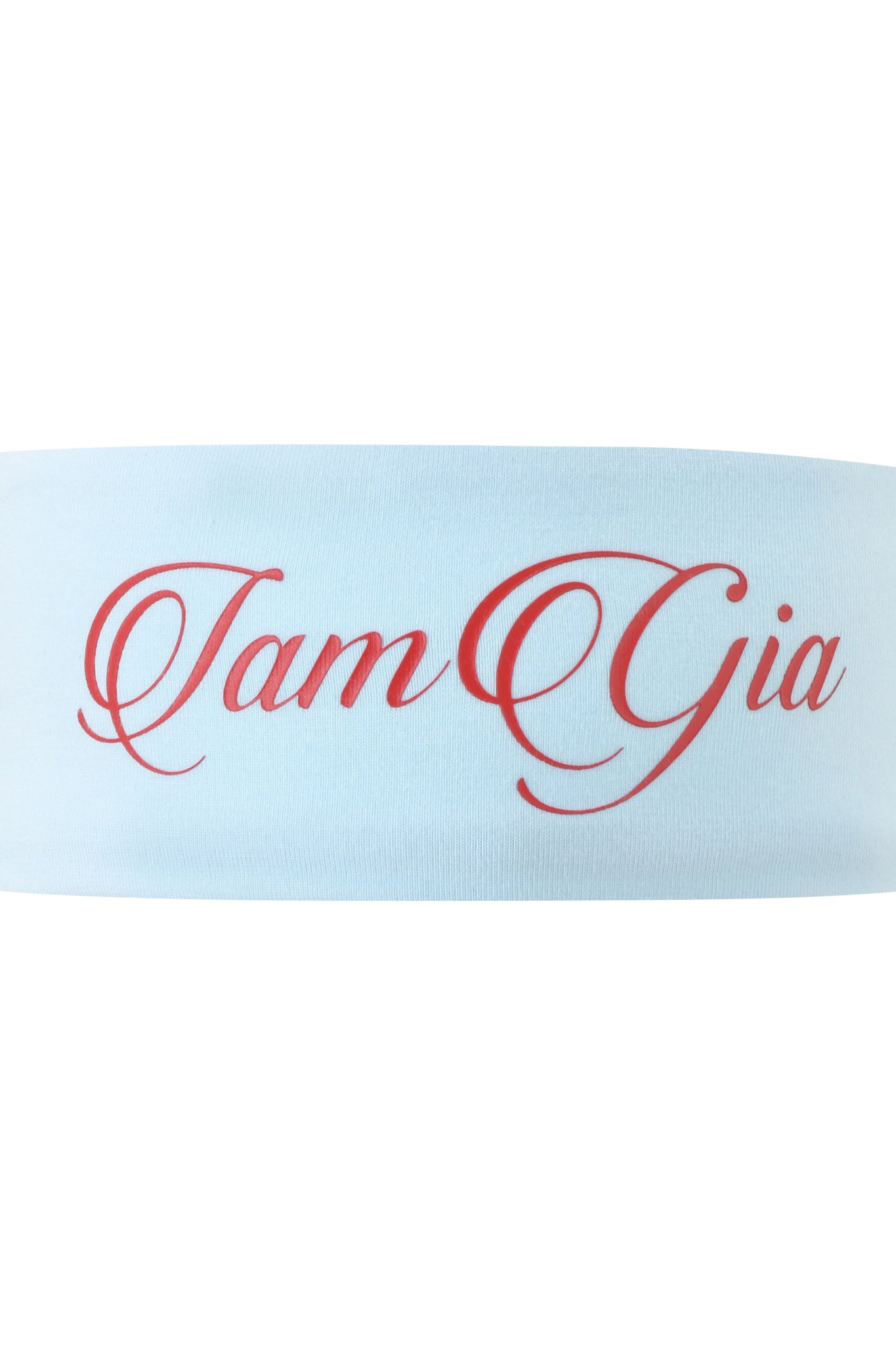 The BLARE SPORT HEADBAND - BABY BLUE by I.AM.GIA features elegant red cursive "I am Gia" lettering, making it a stylish and sporty accessory for your look.