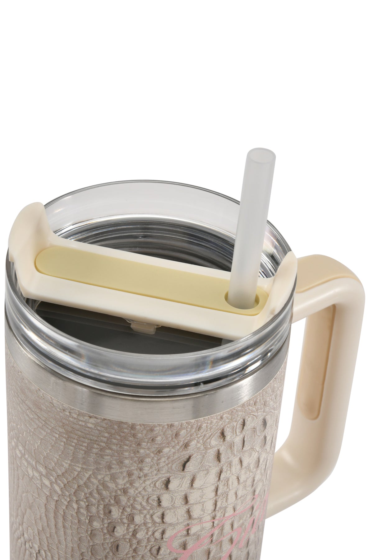 The 40oz BLARE CUP - HOT CROC by I.AM.GIA is an insulated stainless steel tumbler in beige, featuring a subtle crocodile print texture. It comes with a clear lid, a white straw inserted through the opening, and a light-colored handle—blending practicality with sophisticated style.