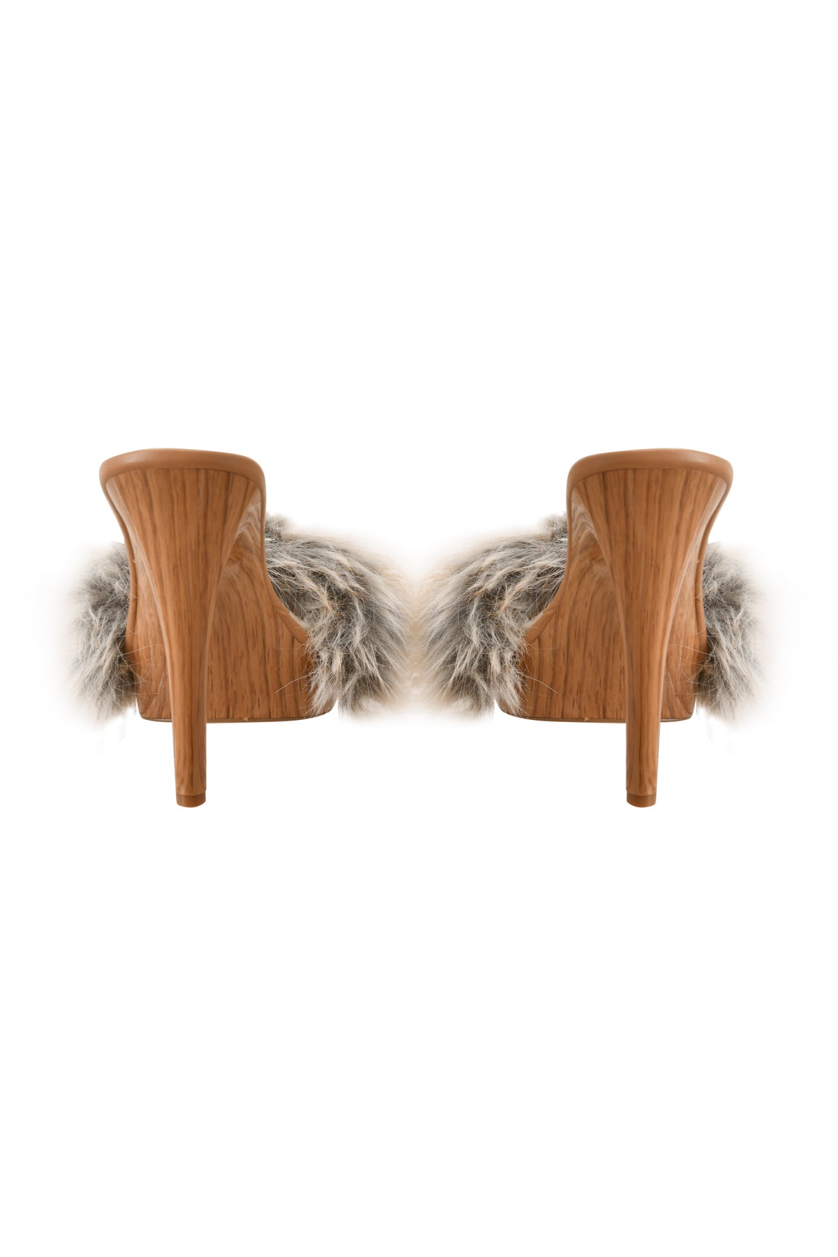 A pair of NICKY HEEL - FAUX FUR TAN mule shoes by I.AM.GIA, featuring high wooden soles and slip-on Nicky heels with fluffy gray faux fur straps on the uppers, displayed from the back against a white background.