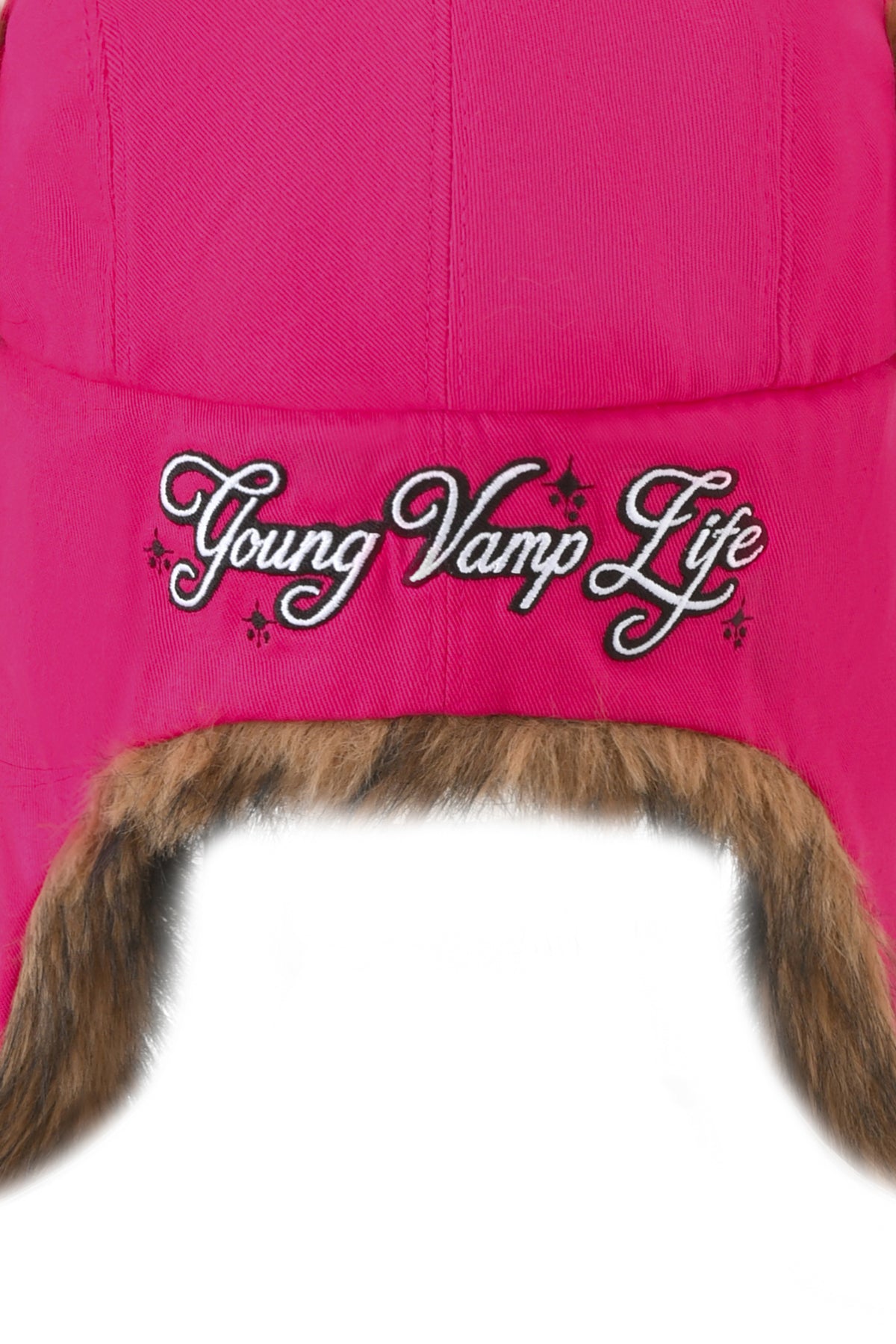 I.AM.GIA YVL FUR TRAPPER HAT - PINK in hot pink faux fur with brown lining and “Young Vamp Life” embroidered in white script.