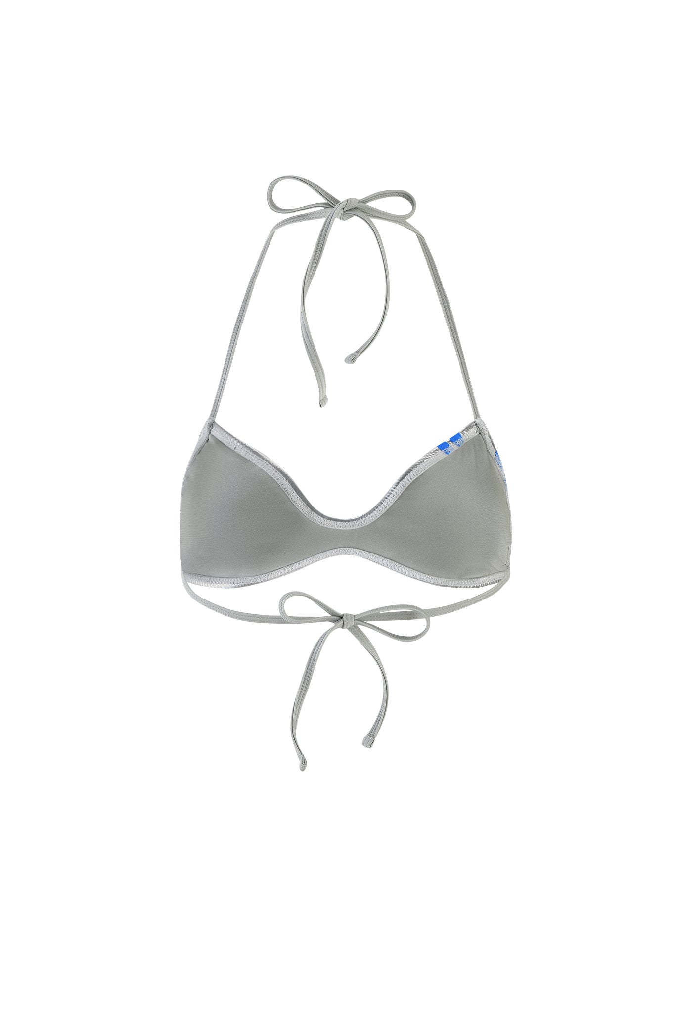 The HOLLY BIKINI TOP - SILVER from I.AM.GIA is a chic and sophisticated gray bikini top featuring halter neck and back tie closures, accented with a subtle blue detail on the upper right corner. Its simple yet elegant design makes it perfect for swimwear.