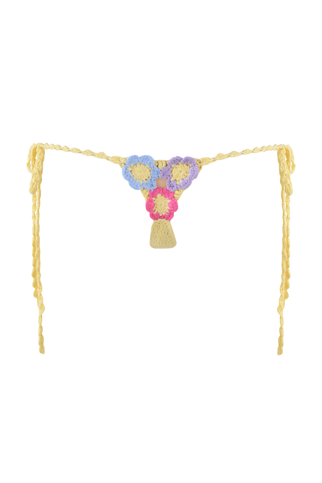 The BLOSSOM BIKINI BOTTOM - MULTI by I.AM.GIA is a colorful crochet piece featuring adjustable side ties. It boasts pastel blue, purple, and pink flower motifs on a yellow background for a vibrant and playful look.