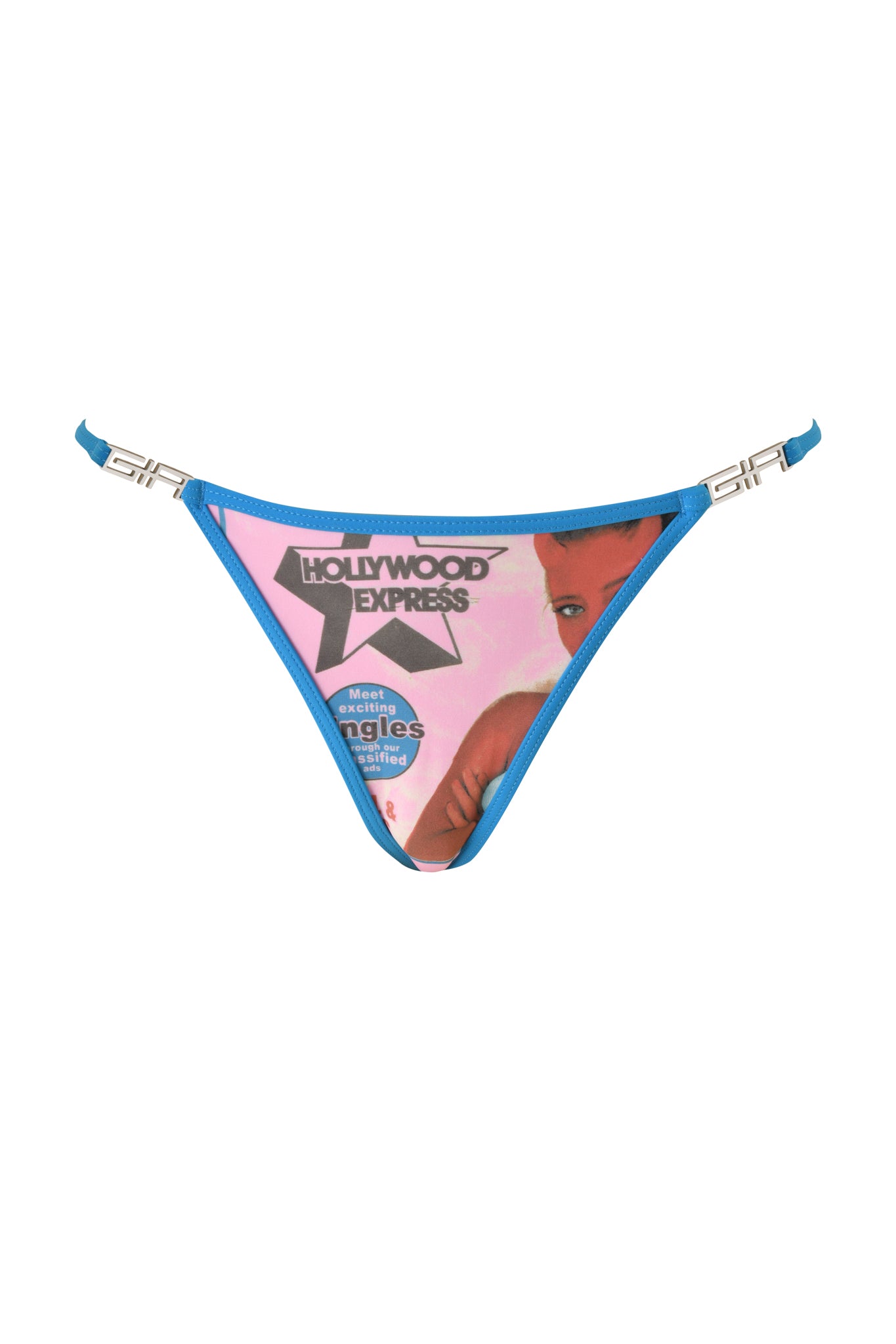 The T-REX AVA BIKINI BOTTOM in pink from I.AM.GIA features a print of a vintage magazine cover with a woman's face, "Hollywood Express" text, and other colorful graphics on the front panel.