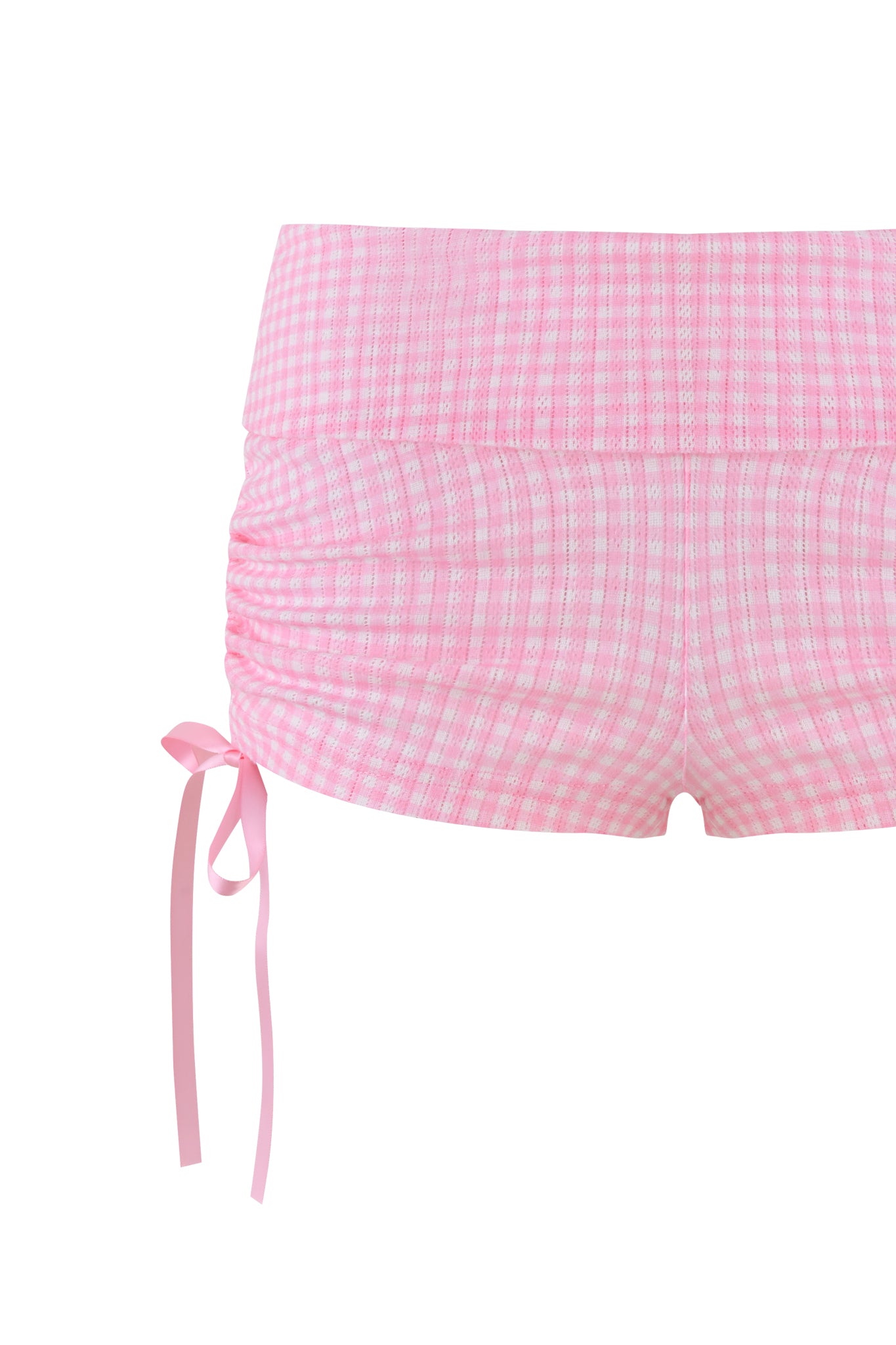 The MIA SHORT - PINK by I.AM.GIA are high-waisted gingham shorts featuring side ruching and a bow on the left, with a classic light pink and white checkered design that's perfect for playful summer adventures.