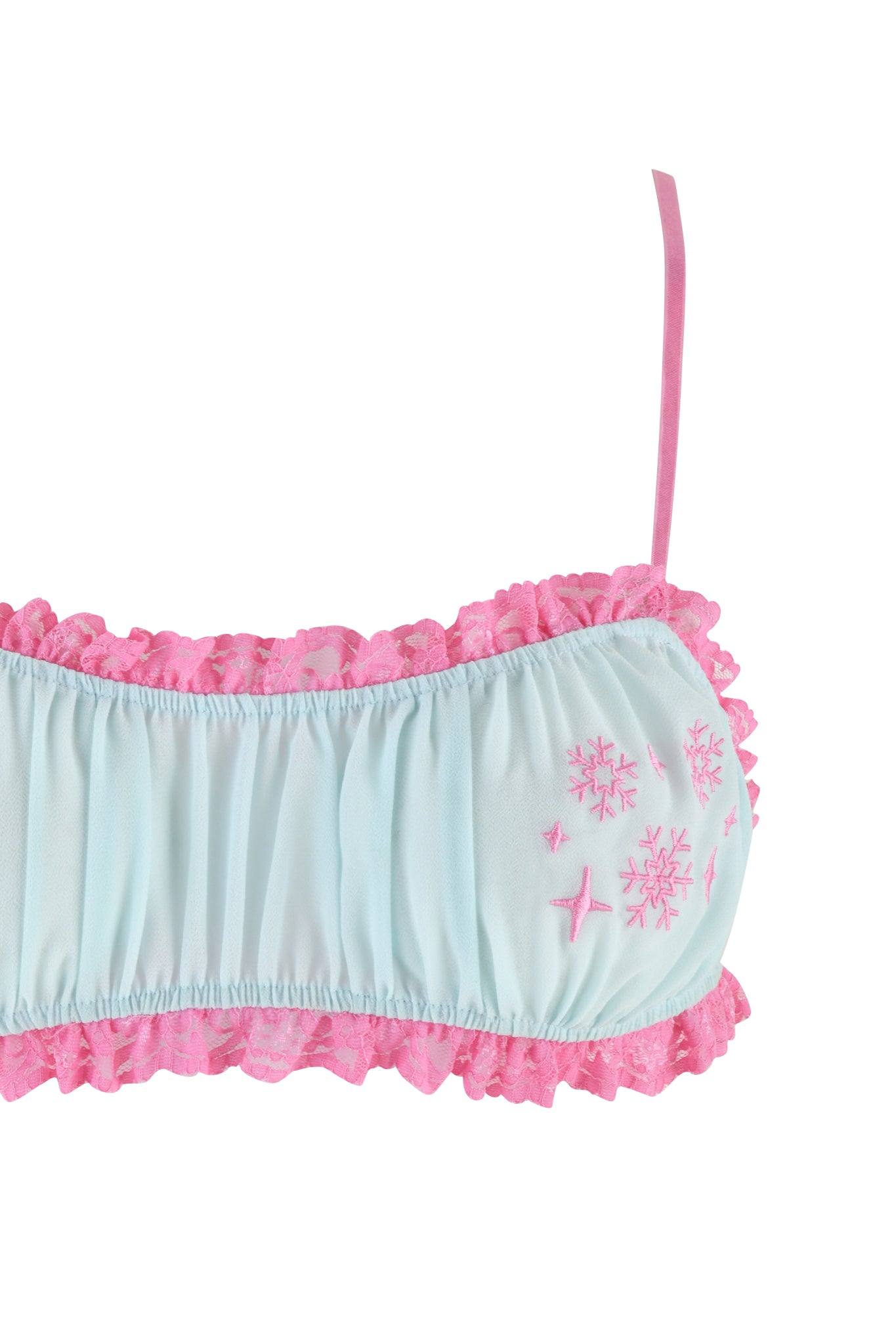 The mint green JUNIPER ROBE THREE-PIECE SET by I.AM.GIA pairs perfectly with a light blue sleep mask that features pink lace trim, thin pink straps, and embroidered pink snowflakes on the right side. This charming addition complements an adjustable bralette or a robe with lace paneling for a cohesive, cozy look.