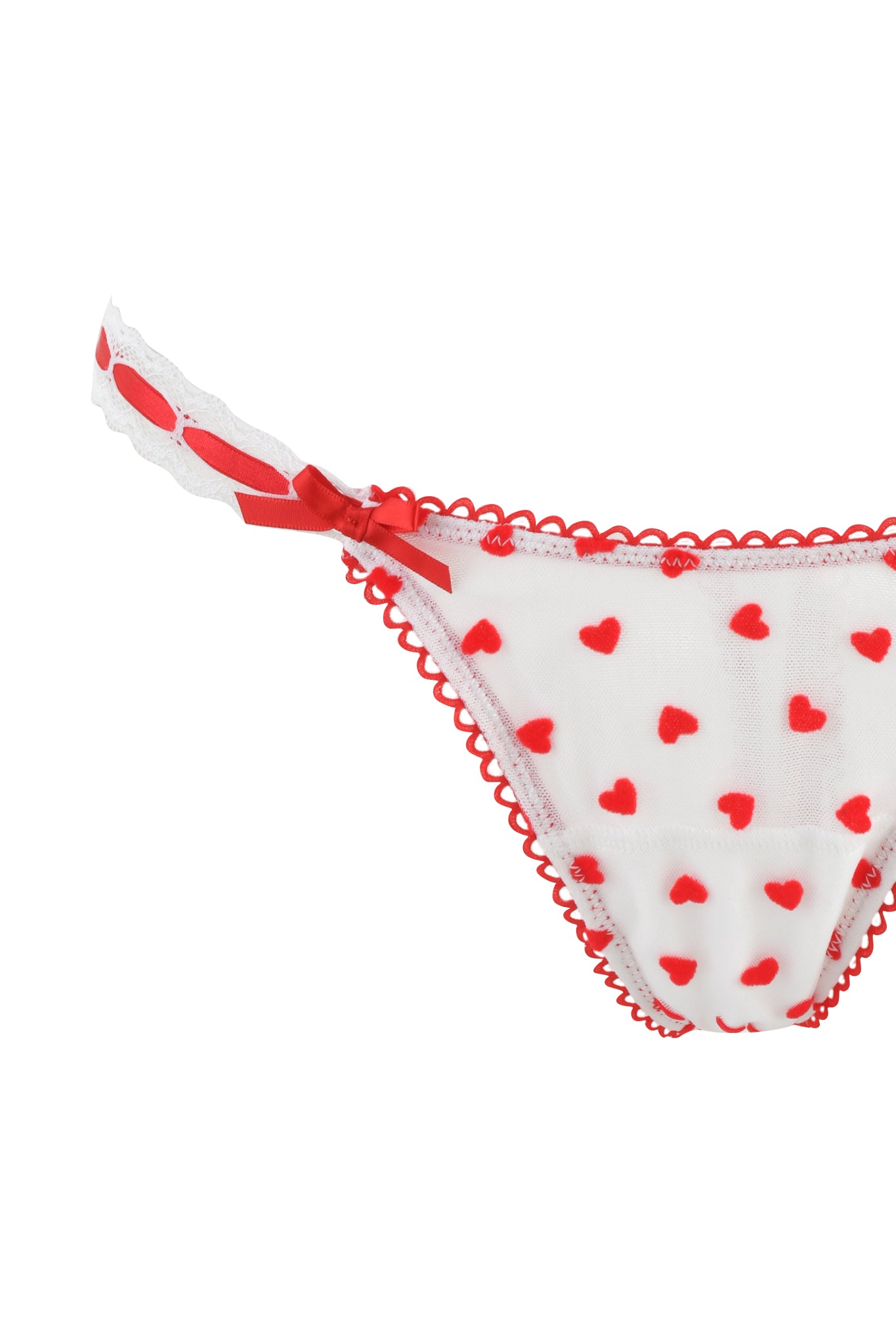 The ROMY 2 PIECE SET - WHITE : HEARTBEAT by I.AM.GIA features white lacy underwear with red heart patterns, scalloped edges, and a vintage-inspired bra. A charming small red bow decorates one of the adjustable elastic side straps.