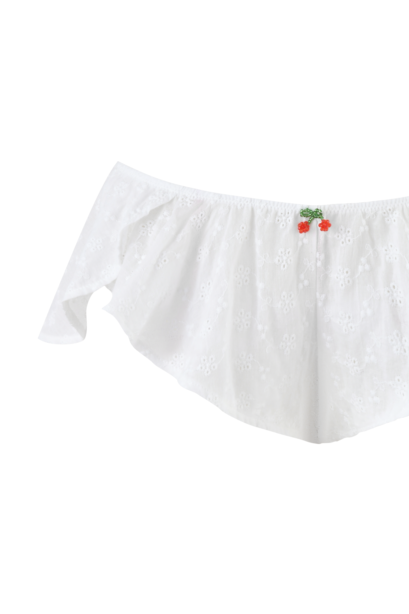 The JUNIE SHORT SET by I.AM.GIA features a white, off-the-shoulder crop top with cherry embroidery and beaded accents at the neckline, finished with short, ruffled sleeves.