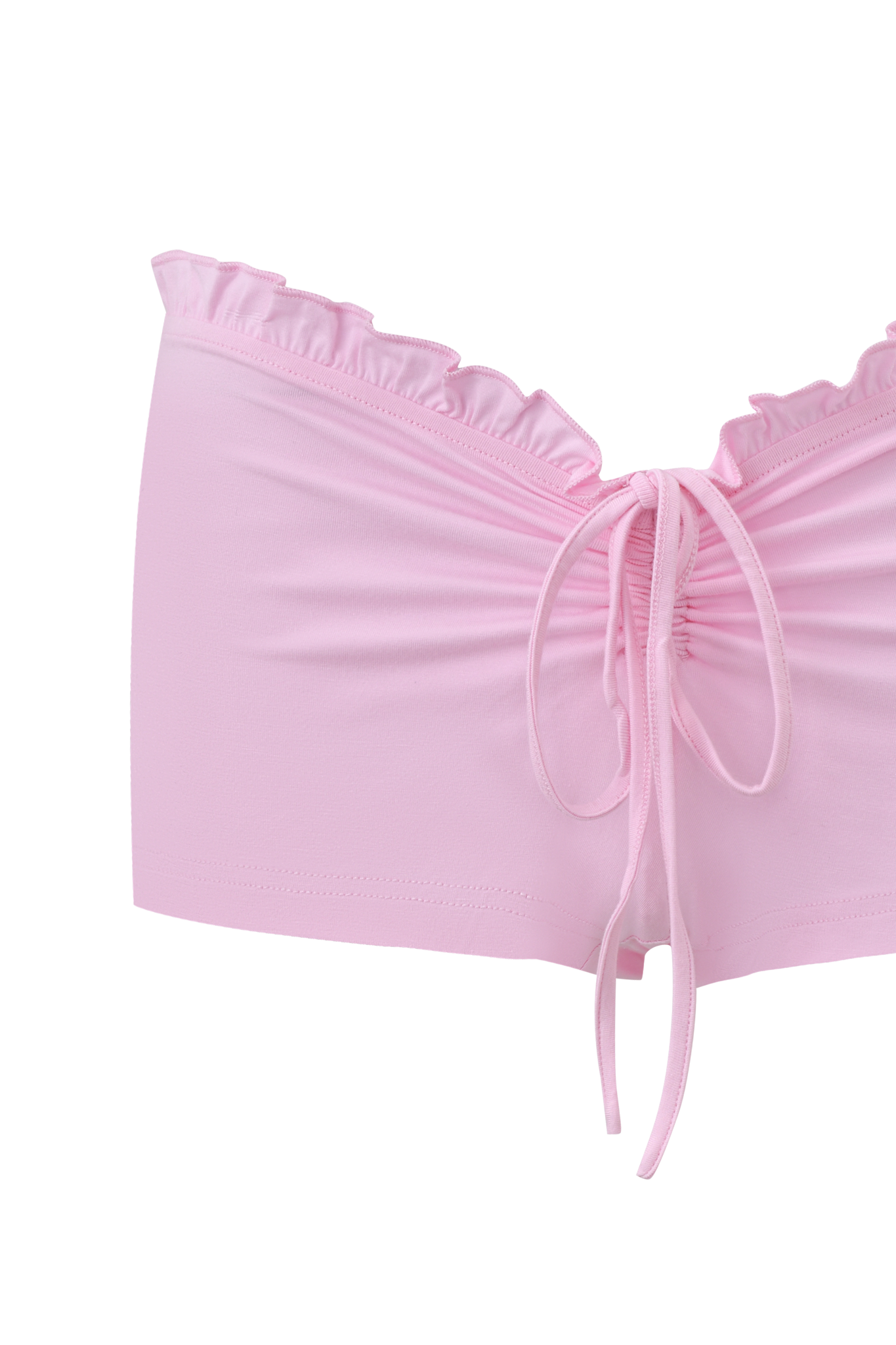 The MELANIE SHORT - PINK by I.AM.GIA are light pink women's shorts in semi-sheer bamboo jersey, featuring a ruffled waistband, gathered back, and a decorative bow tied with pink strings at the center.