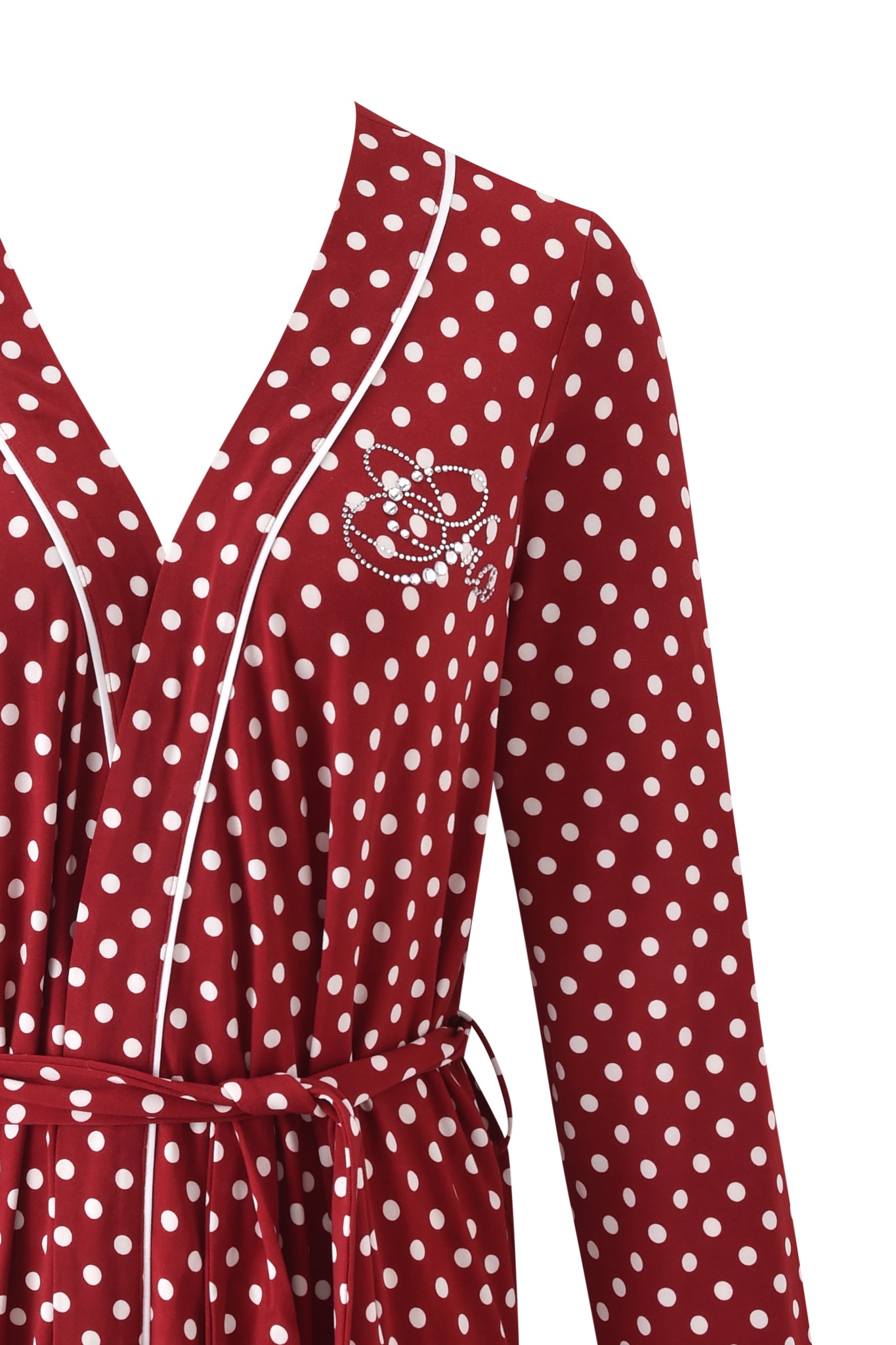 A close-up of the I.AM.GIA MELANIE SLEEPWEAR - RED POLKA DOT shows white piping at the neckline, a fabric waist belt, and white beaded detail on the left chest. Only the top half is shown; pairs well with the matching robe and eye mask.