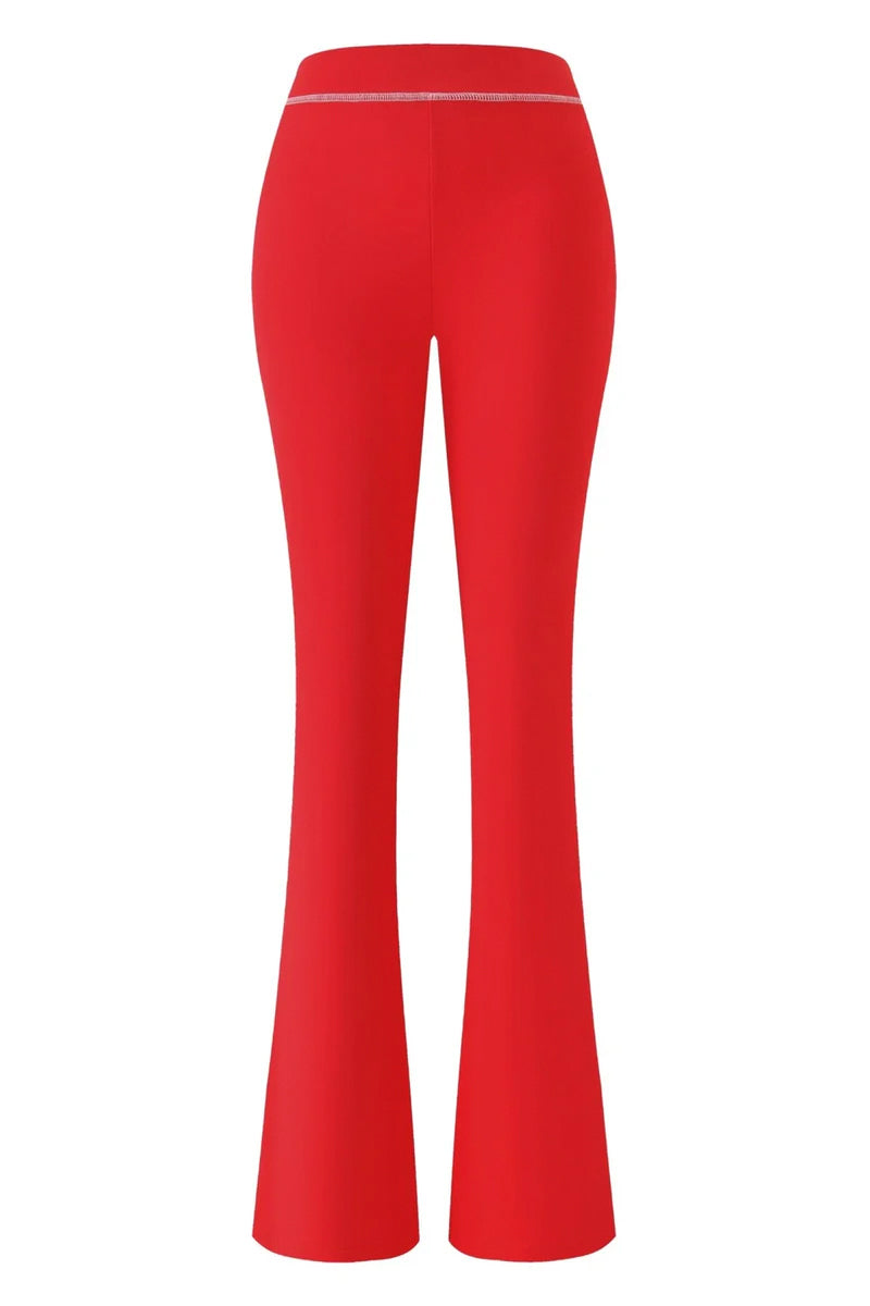 The I.AM.GIA X SEXYY RED BLARE TRACKPANT in red is shown from the back, featuring a high-waisted fit with a fitted silhouette at the hips and thighs and wider legs from the knees down—your new favorite.