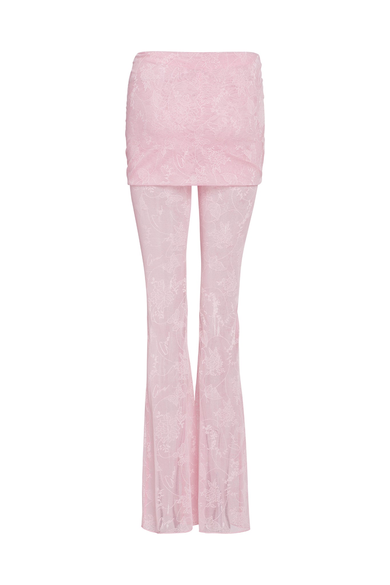 The NALLIAH PANT - PINK : LACE by I.AM.GIA are light pink sheer trousers featuring a short skirt overlay, a subtle floral pattern, and a slight flare at the bottom.
