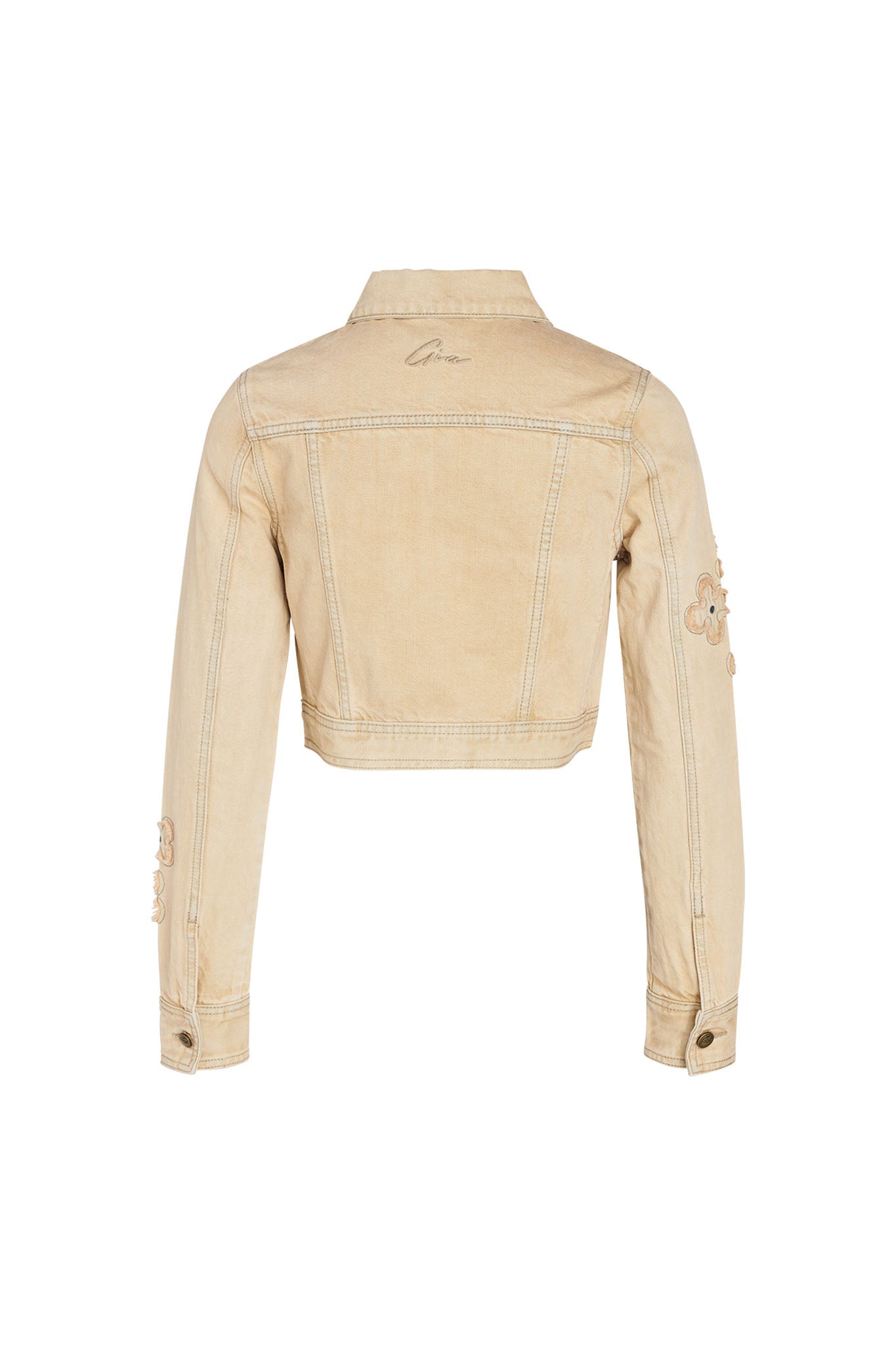 The FAUNA JACKET - BEIGE : TAN DENIM by I.AM.GIA is depicted from the back, showcasing buttoned cuffs, decorative embroidery on the sleeves, and subtle stitching accents. The cropped fit jacket also features a faint I.AM.GIA logo near the upper back.