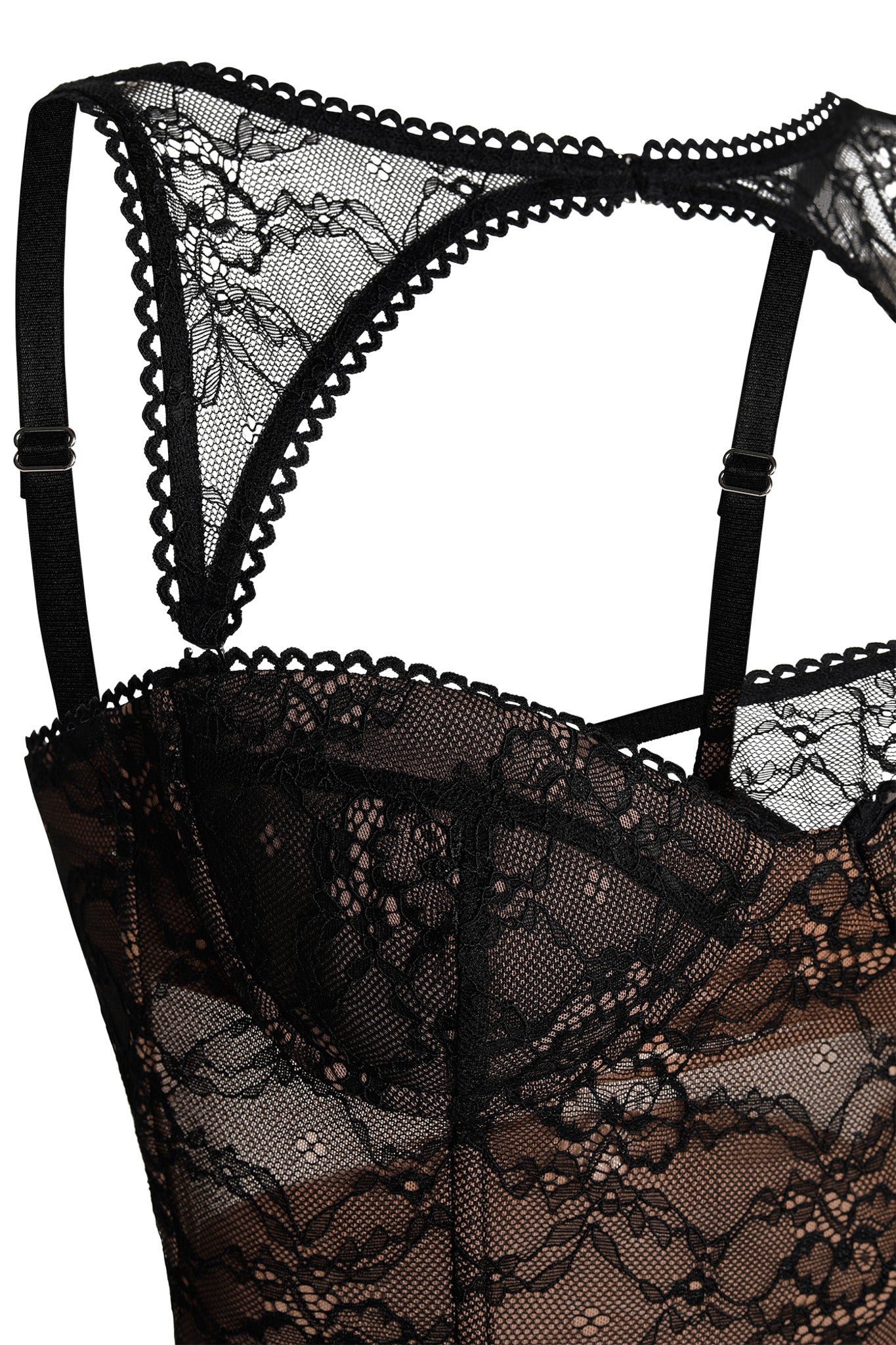 Close-up image of the KIANA BUSTIER - BLACK by I.AM.GIA with adjustable shoulder straps and intricate floral lace patterns. The lace is semi-sheer, and detailed scalloped edges are visible along the neckline and straps.