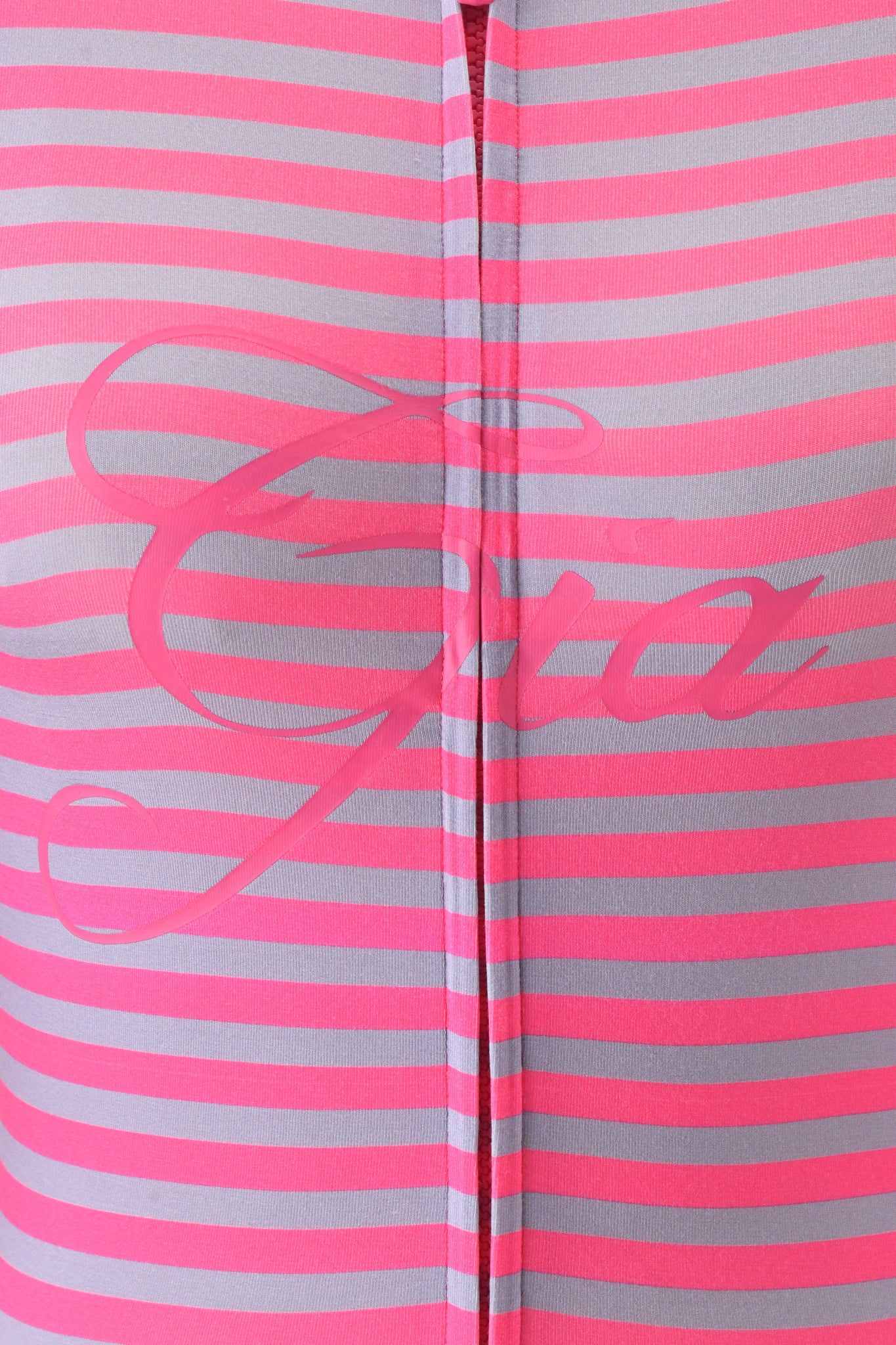 Close-up of the BLARE HOODIE - HOT PINK STRIPE by I.AM.GIA, featuring pink and light gray stripes, "Giro" in cursive pink lettering across the center, and a vertical seam down the middle.