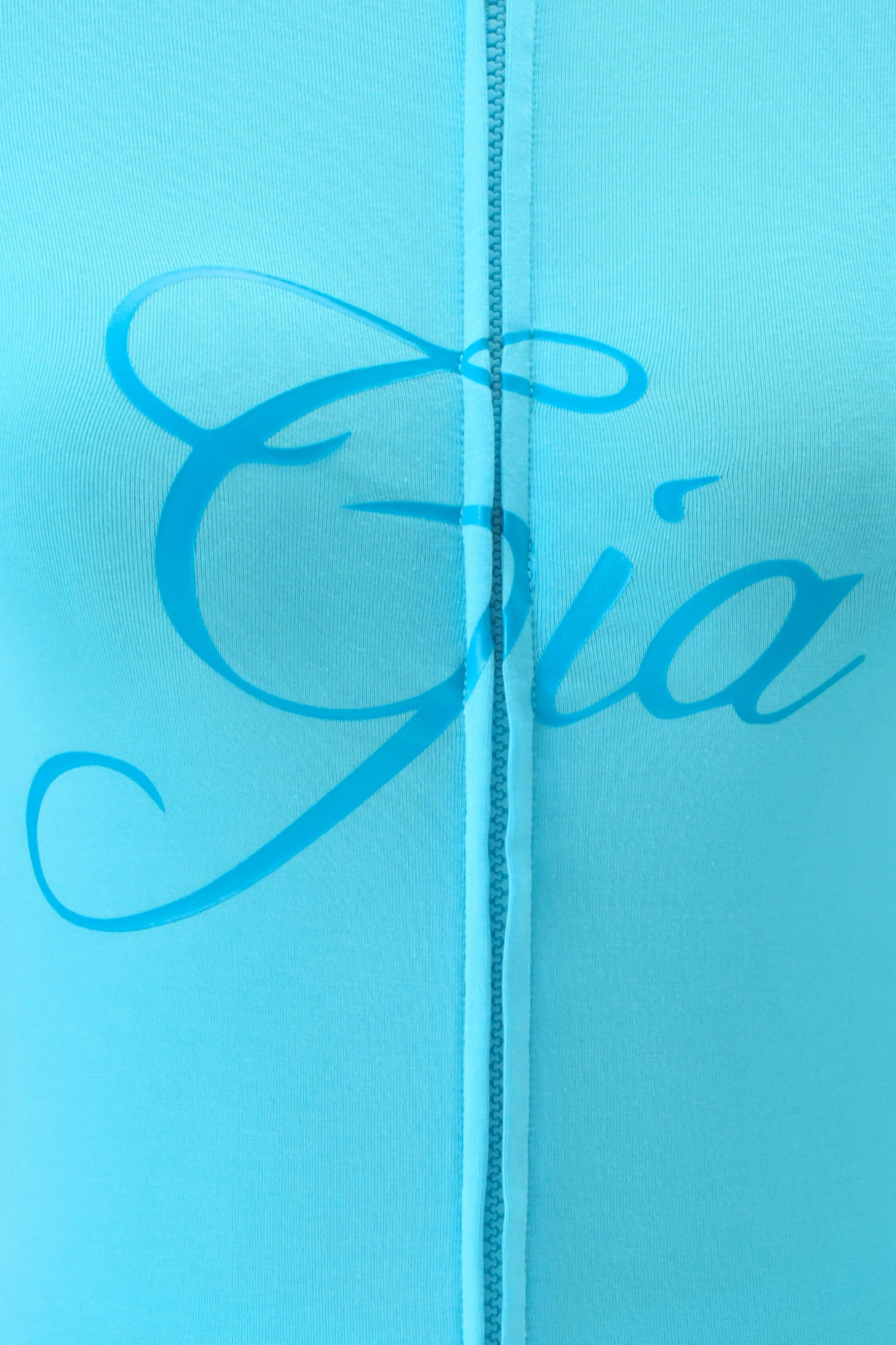 Close-up of the BLARE HOODIE - NEON BLUE by I.AM.GIA, featuring bold "Gia" script across the center and a vertical seam that accentuates its sleek, bodycon fit.