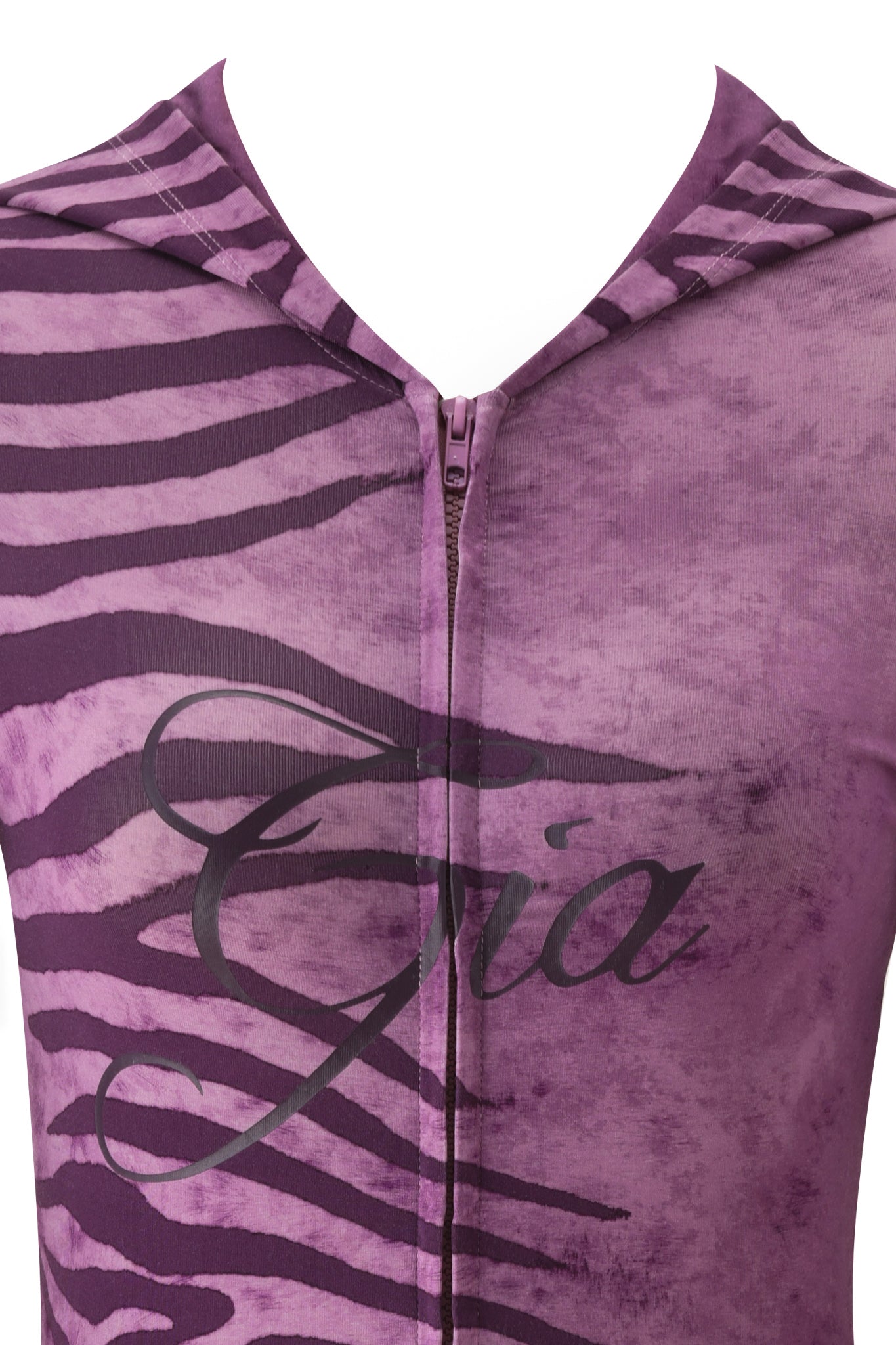 Close-up of the I.AM.GIA BLARE HOODIE - PLUM WILD SIDE, showcasing purple and black zebra stripes, a central zipper, and "Gia" in cursive across the chest.